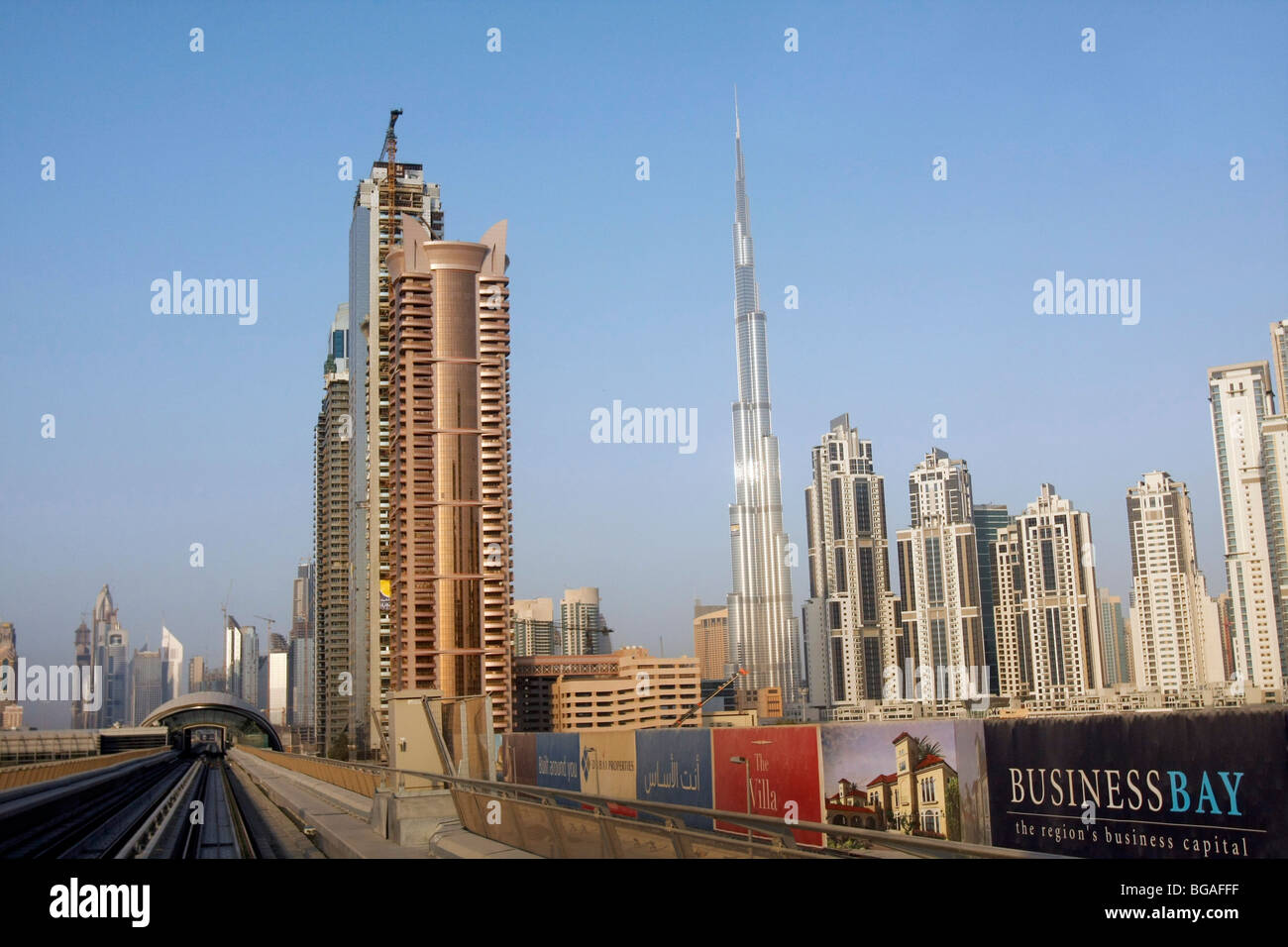 High-rise buildings at the Financial Center in Dubai. The tall narrow building is the Burj Tower, the world's tallest building. Stock Photo
