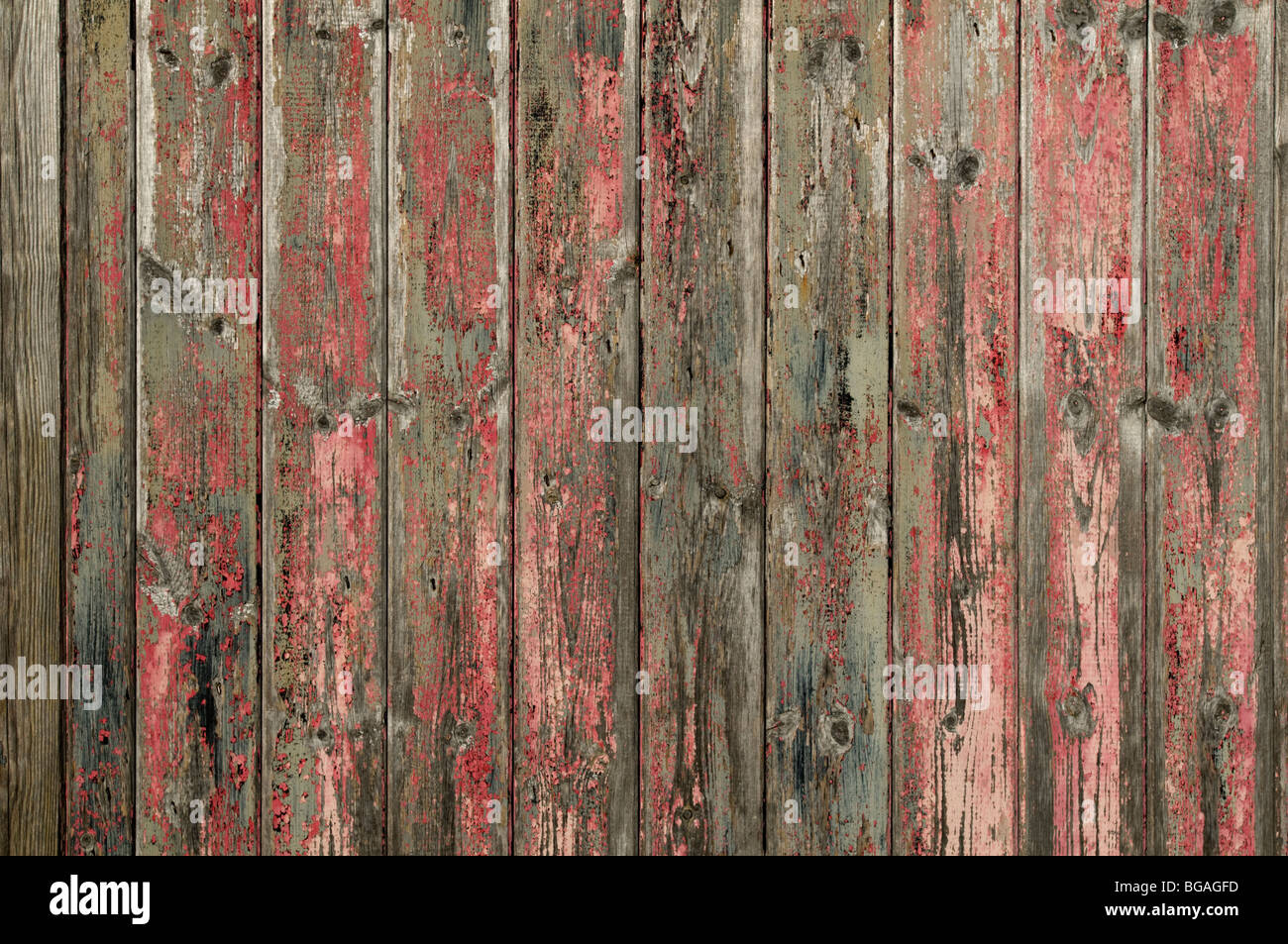 Wooden wall with fading pink paint textured background. Stock Photo