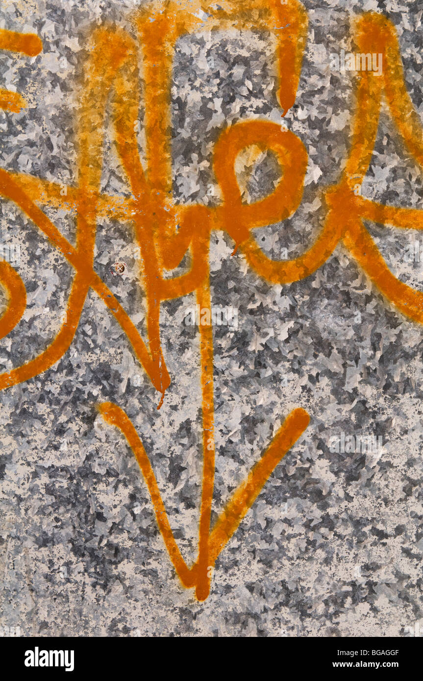 Graffiti on metal surface. Stock Photo