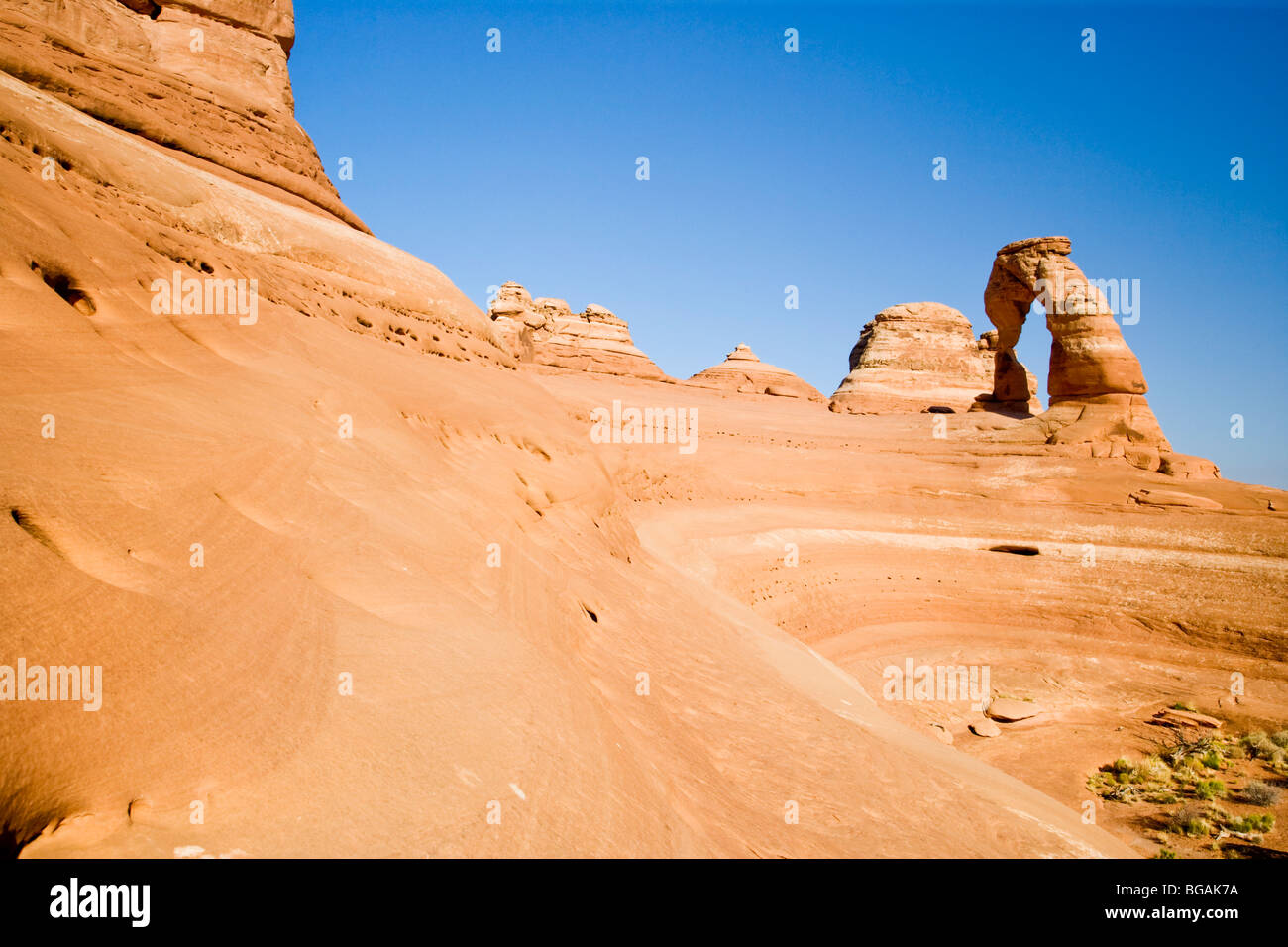 View of Delicate Arch at Arches Canyon (UT) with details of the 'bowl' next to the arch Stock Photo