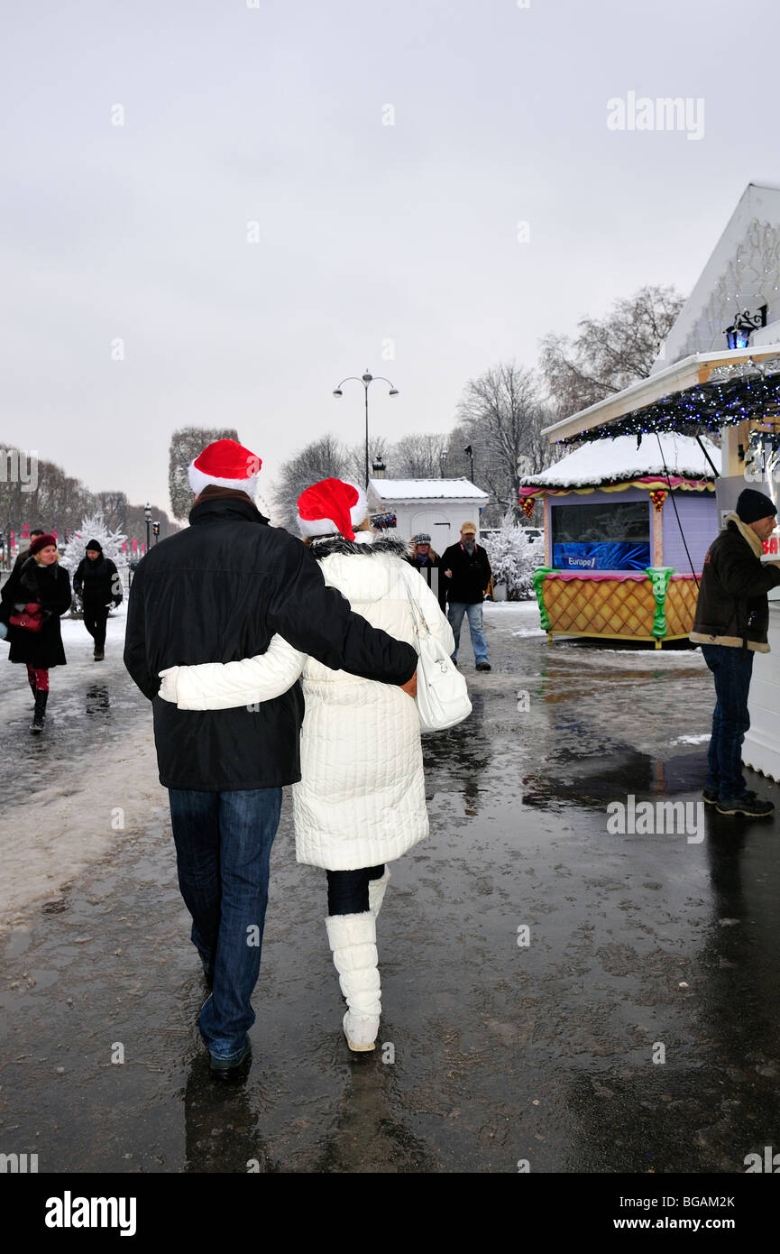 Paris, France, Couple Walking Away, in Christmas Market, Ave. Champs-Elysees, Christmas in Paris, Winter Vacations, behind Stock Photo