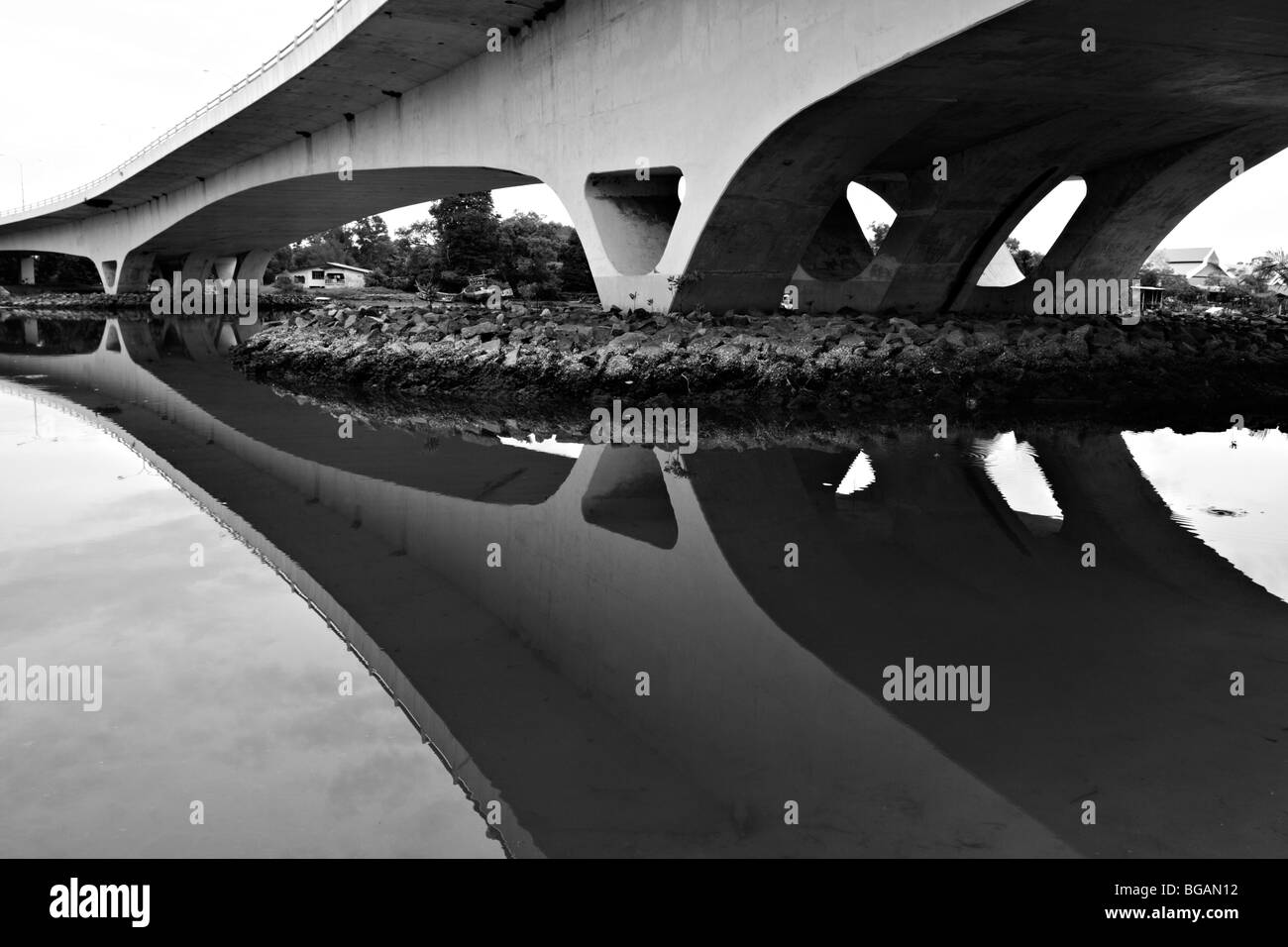 Curved bridge and reflection in black and white. Stock Photo