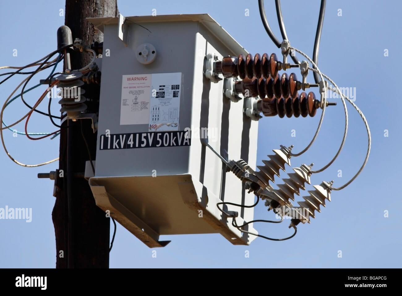 AC highvoltage power transformer on a farm in South Africa Stock Photo