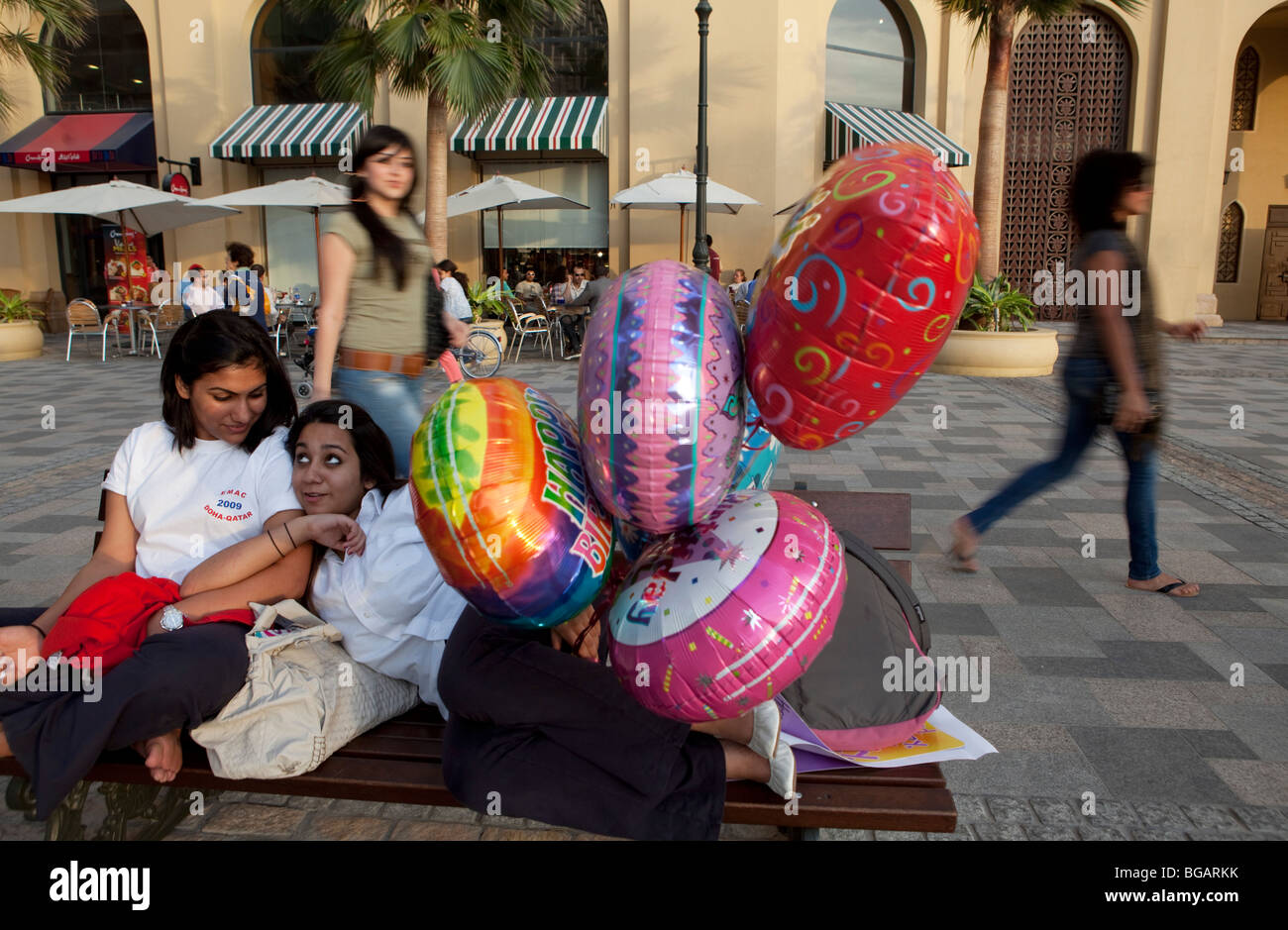Dubai Marina shopping quarter with young woman, Dubai, United Arabian Emirates  Stock Photo