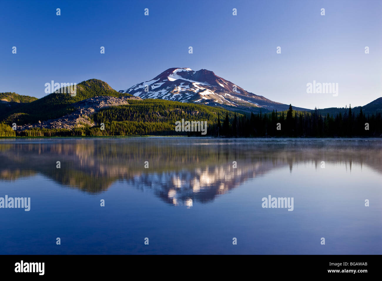 SPARKS LAKE, OREGON, USA - South Sister mountain, Cascades range, reflected in Sparks Lake  early morning. Stock Photo