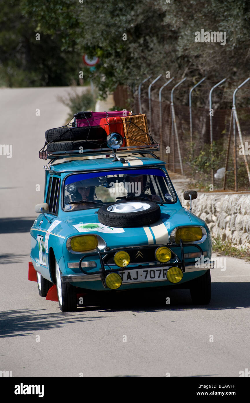 Blue 1970 Citroen Ami 8 classic supermini car being driven in a