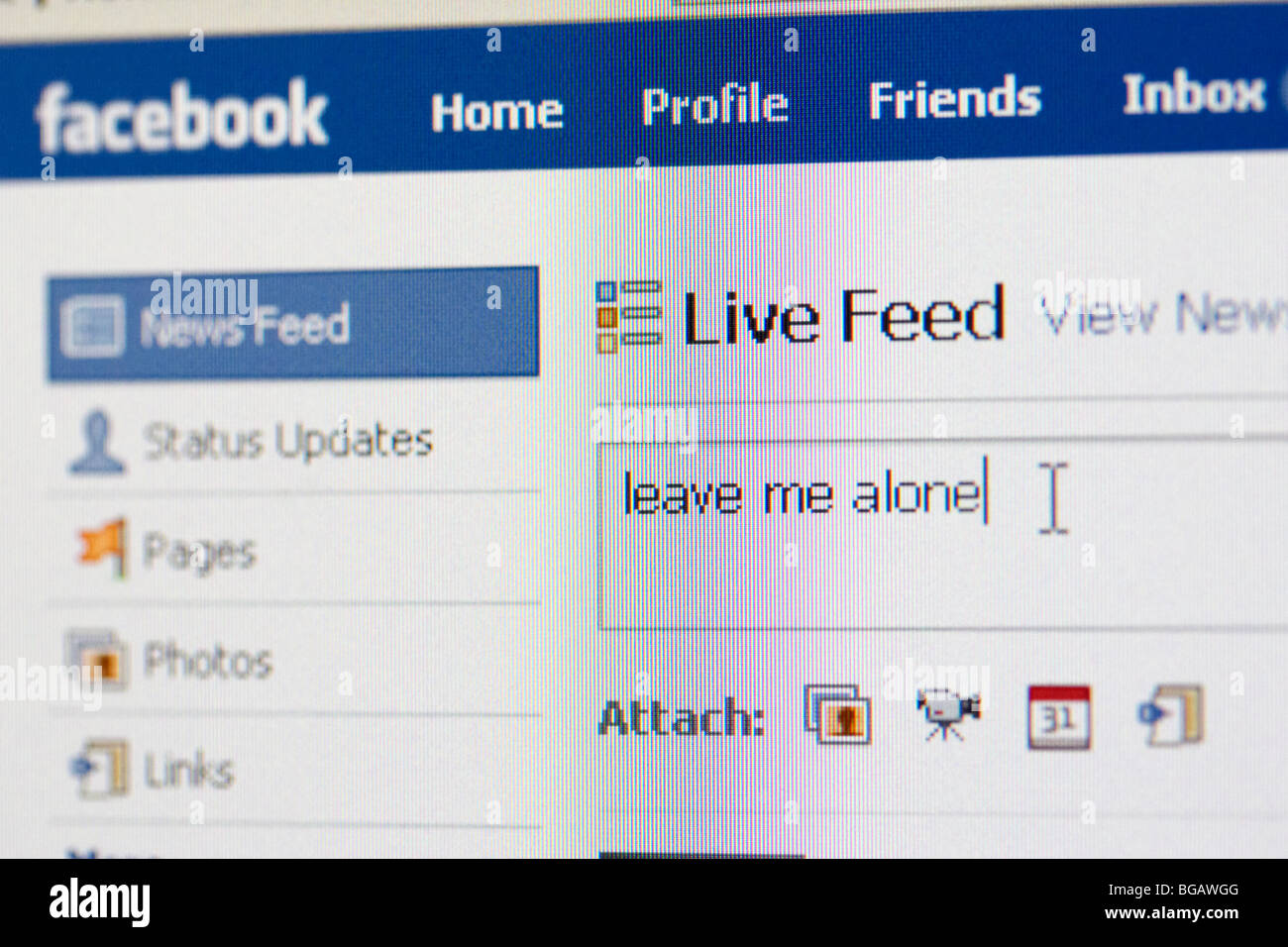 screenshot of leave me alone being typed into live feed status of facebook social networking website for editorial use only Stock Photo