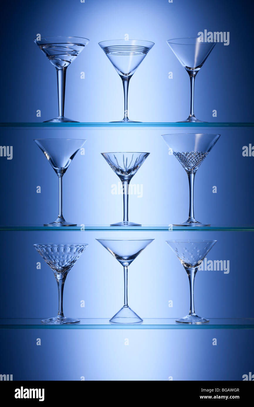 Cocktail glasses on glass shelves Stock Photo Alamy
