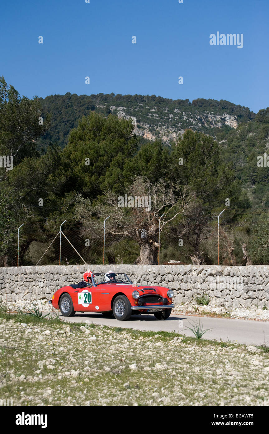 Red 1961 Austin Healey 3000 MK2 classic sports car taking part in a ...