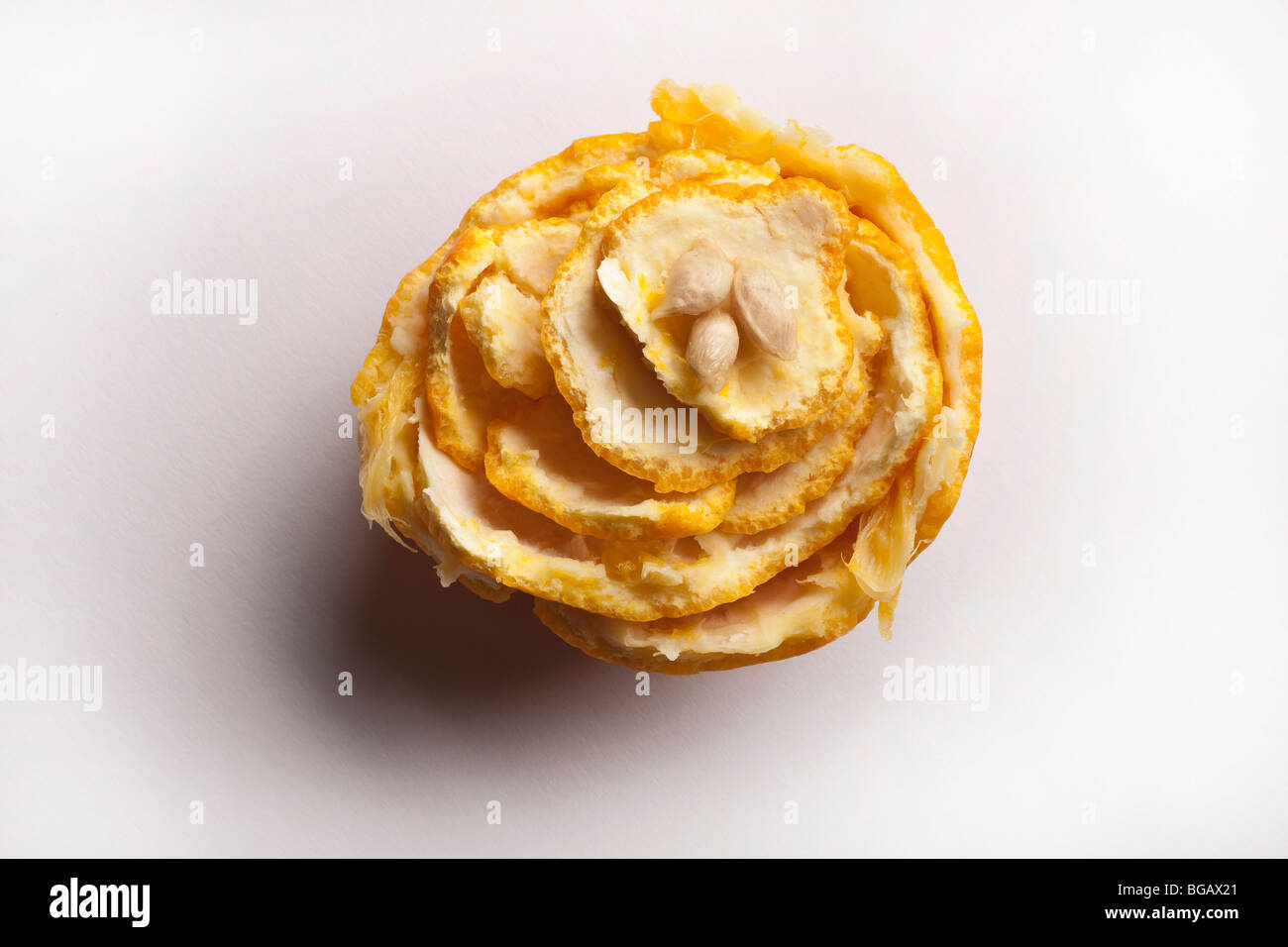 Orange peel and pips arranged in floral design Stock Photo