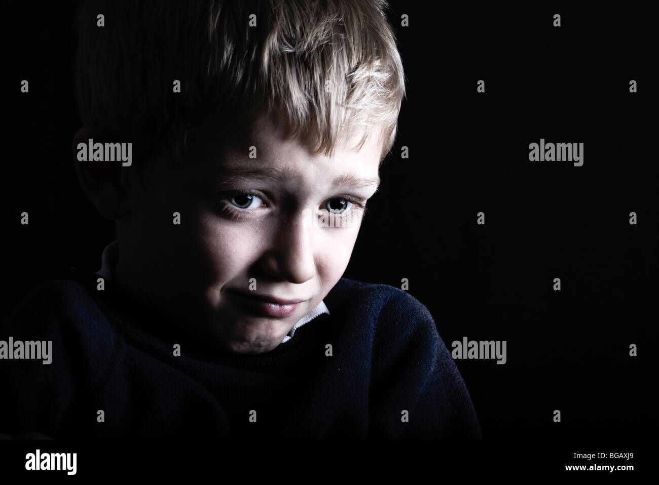 a fearful and scared little boy Stock Photo