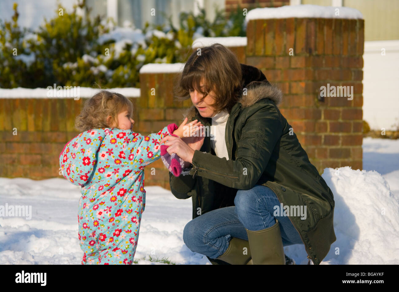 Grandmother and Granddaughter In The Snow Stock Photo