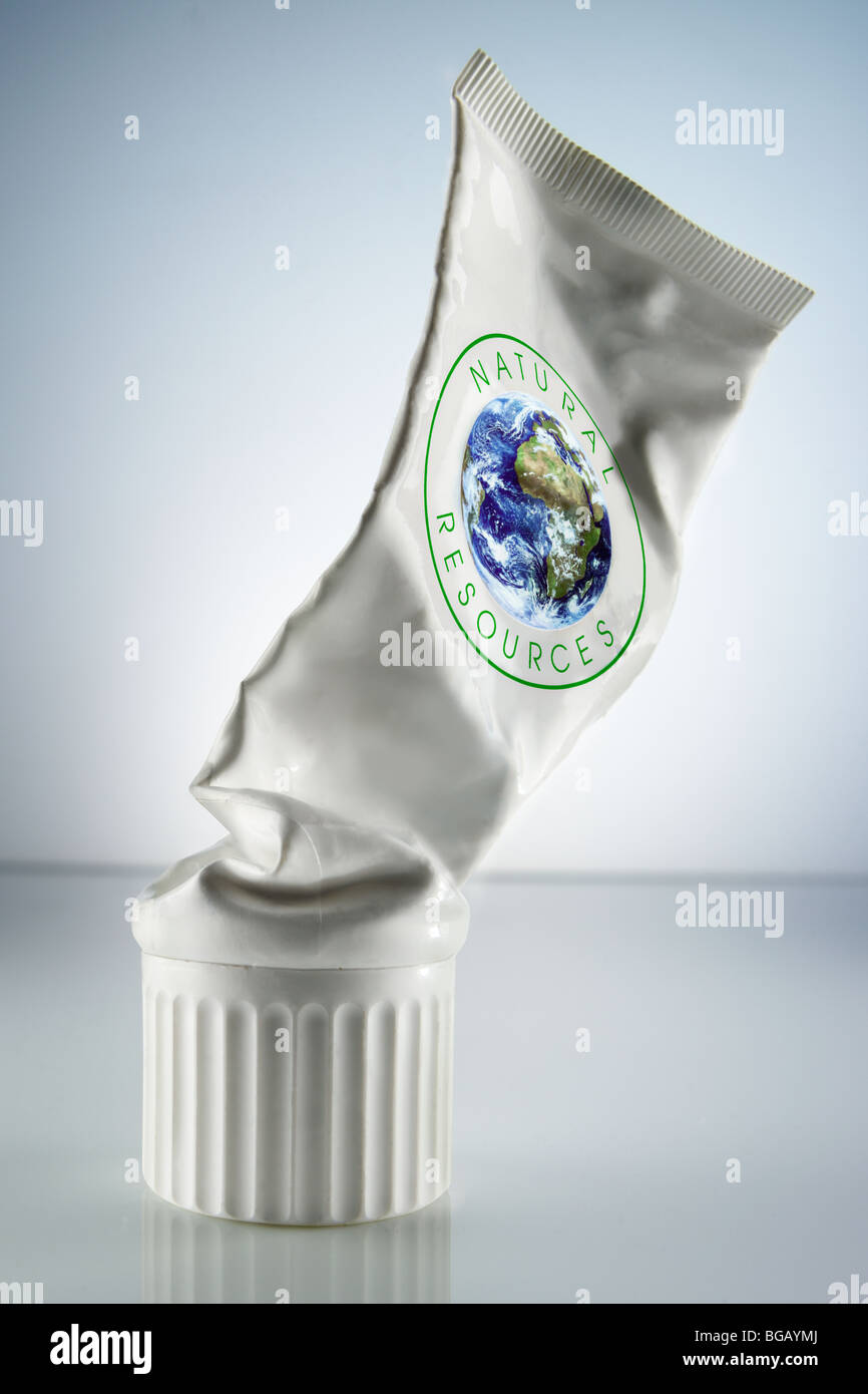 squeezed-out white tube marked with the words natural resources and a globe Stock Photo