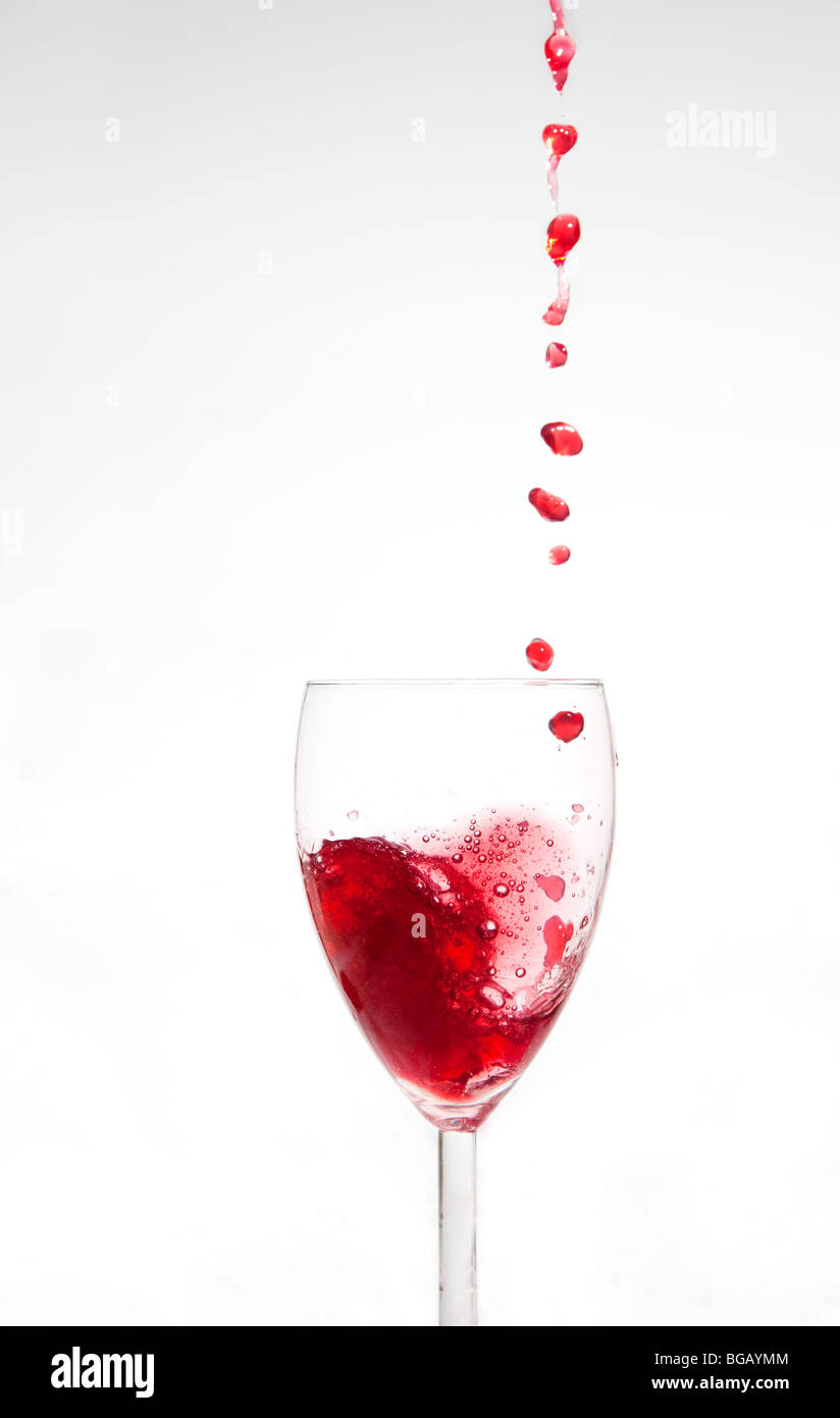 Wine drops falling in to glass Stock Photo Alamy