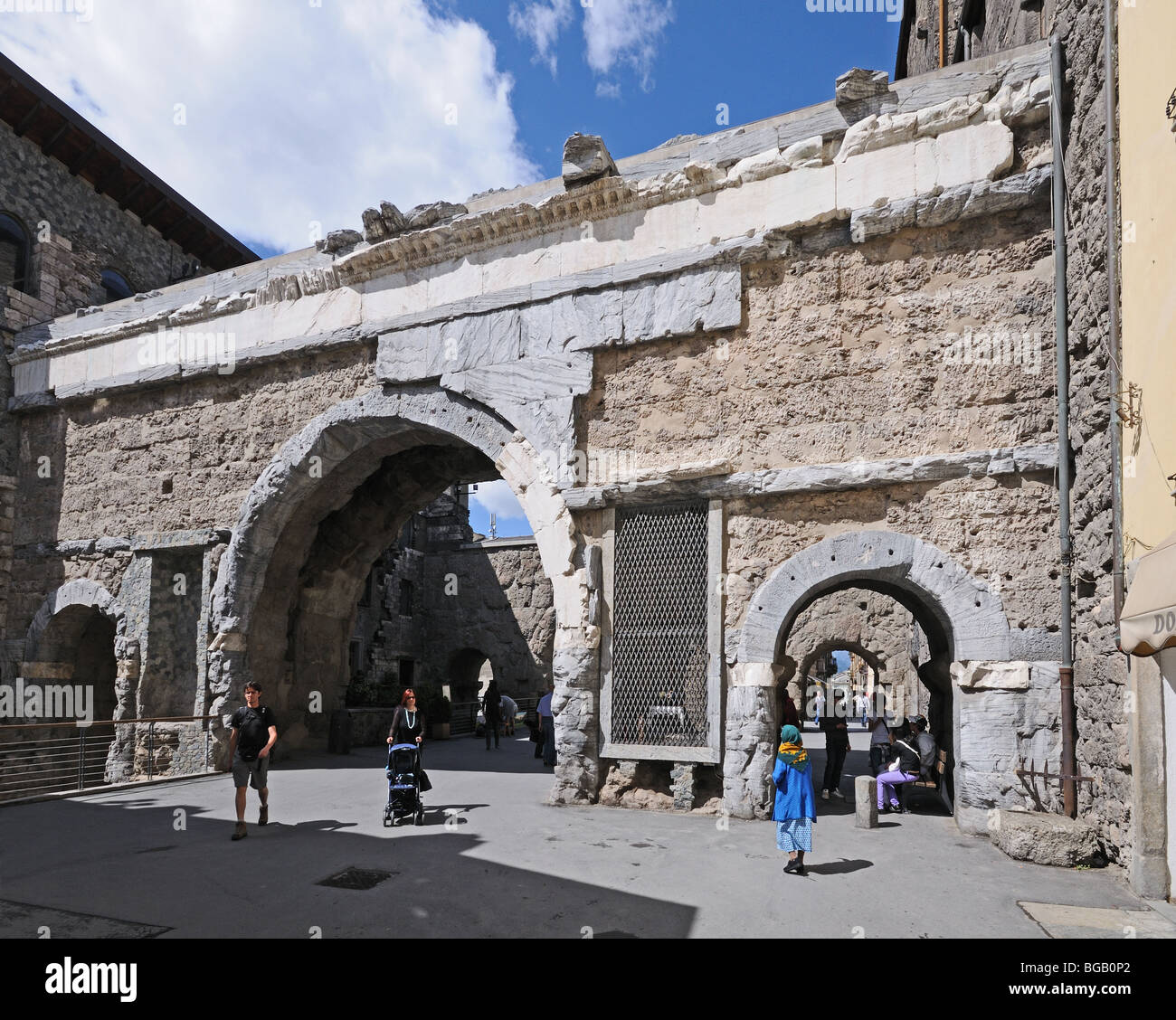 Pretoria or Praetorian Roman gate gateway arch with people walking