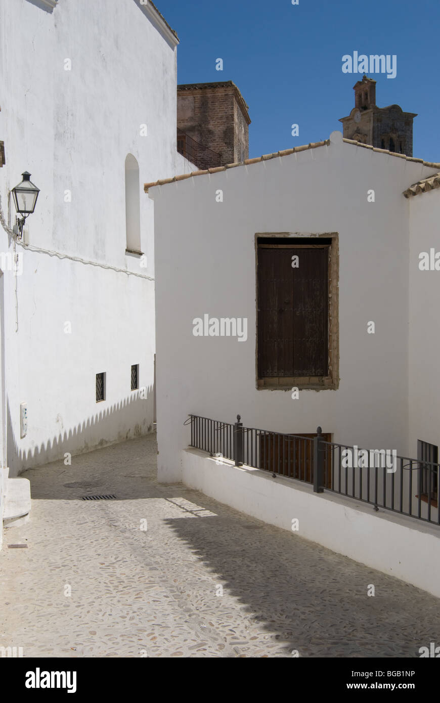 A narrow street with with white houses, Arcos de la Frontera, Spain Stock Photo