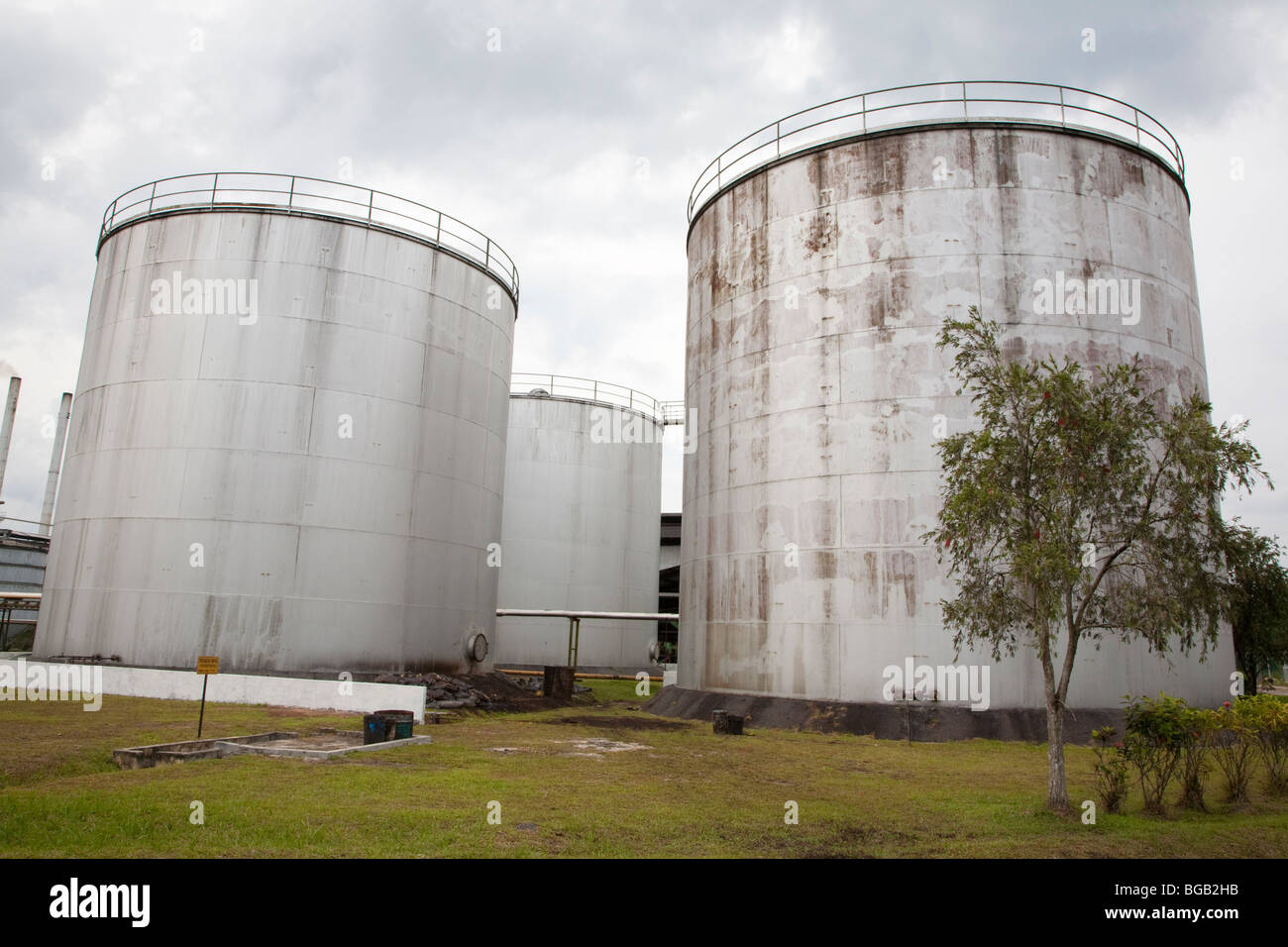 Storage container for palm oil crude. The Sindora Palm Oil Mill is green certified Stock Photo