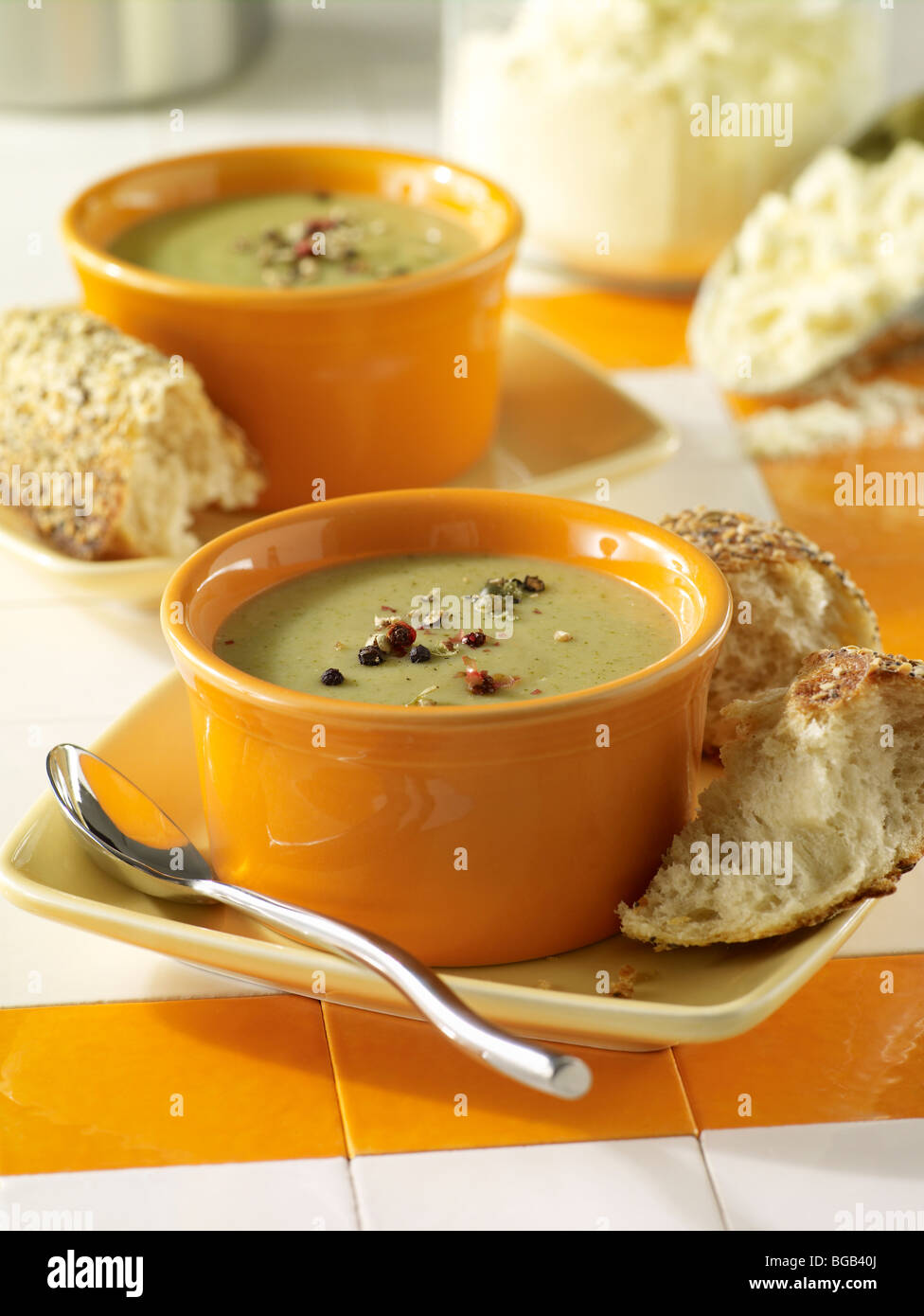 Cream of broccoli soup with pepper and crusty bread Stock Photo