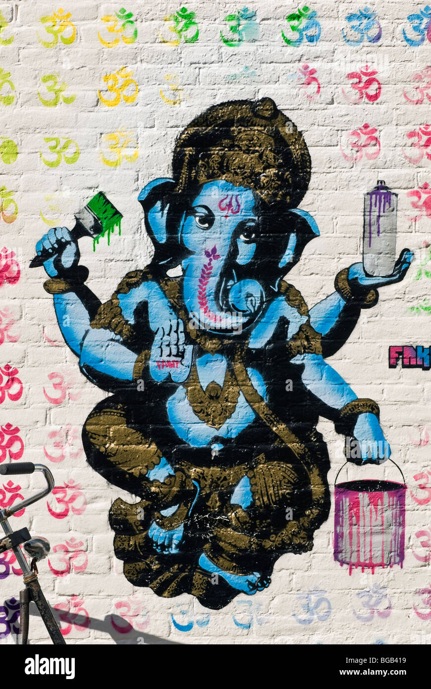 Mural painting of the Hindu god Ganesh holding painting accessories in