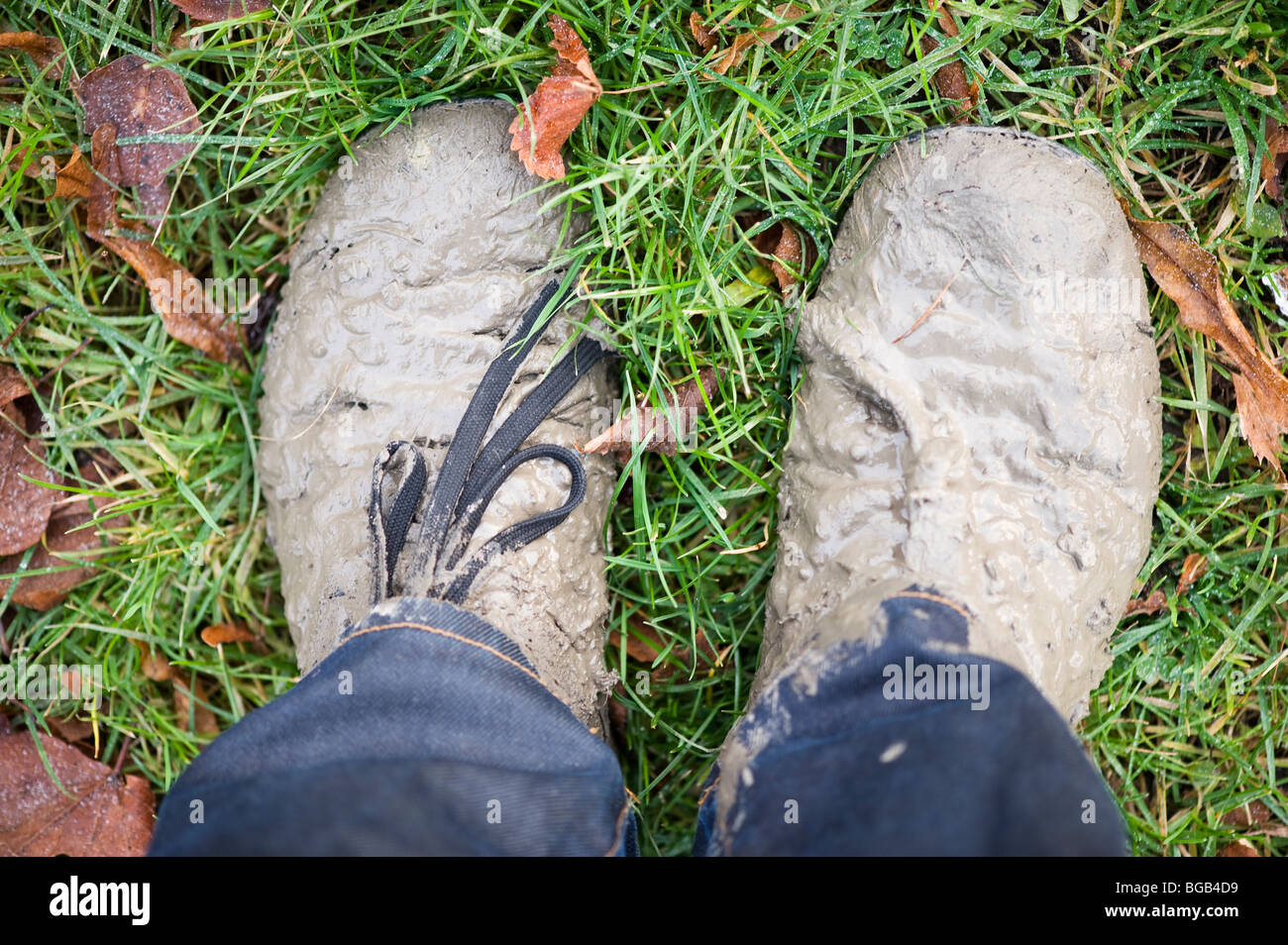 Shoes covered in mud. Stock Photo