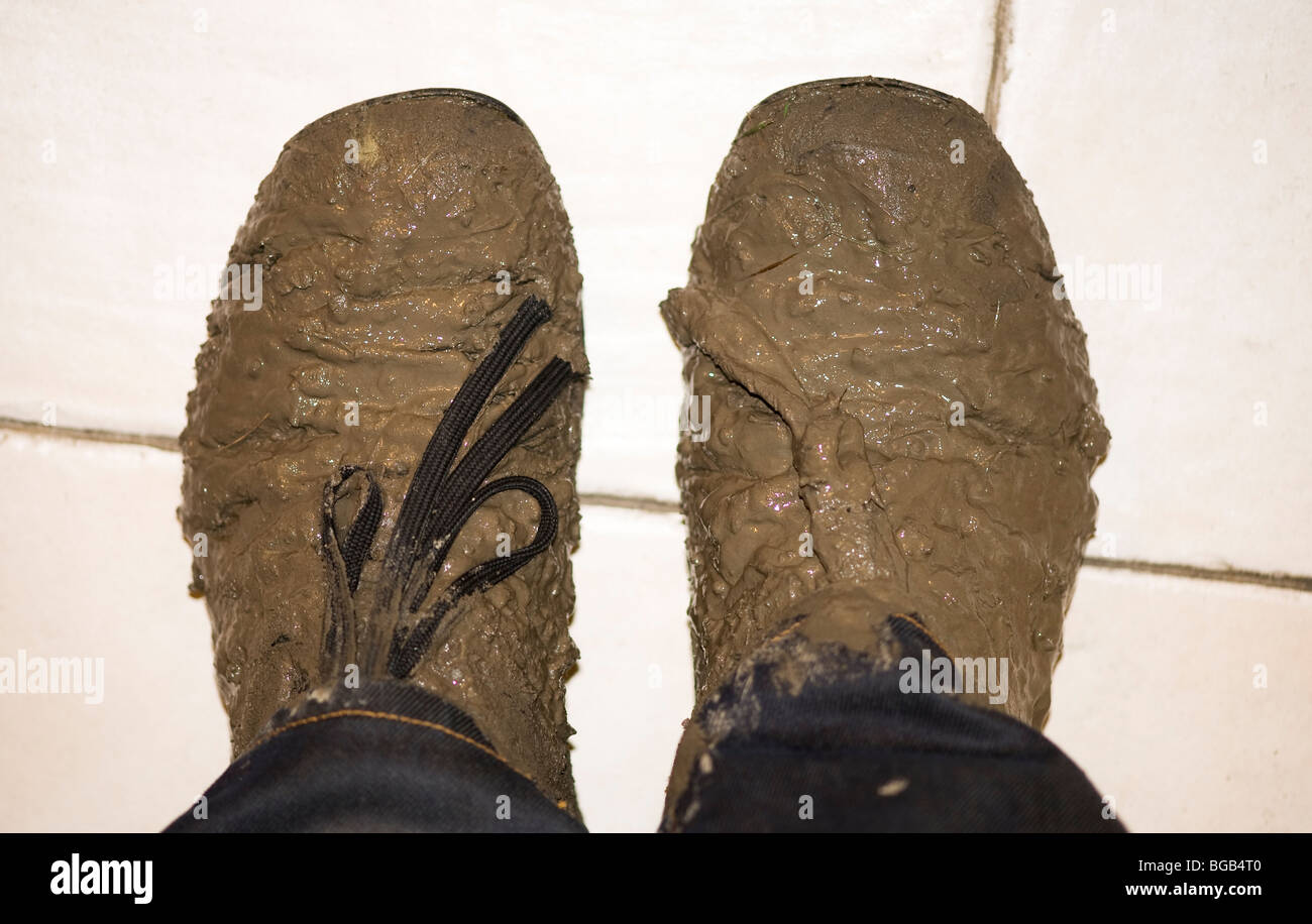 Shoes covered in mud Stock Photo Alamy