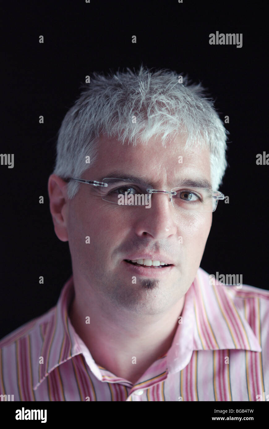 Grey haired man wearing glasses hi-res stock photography and images - Alamy
