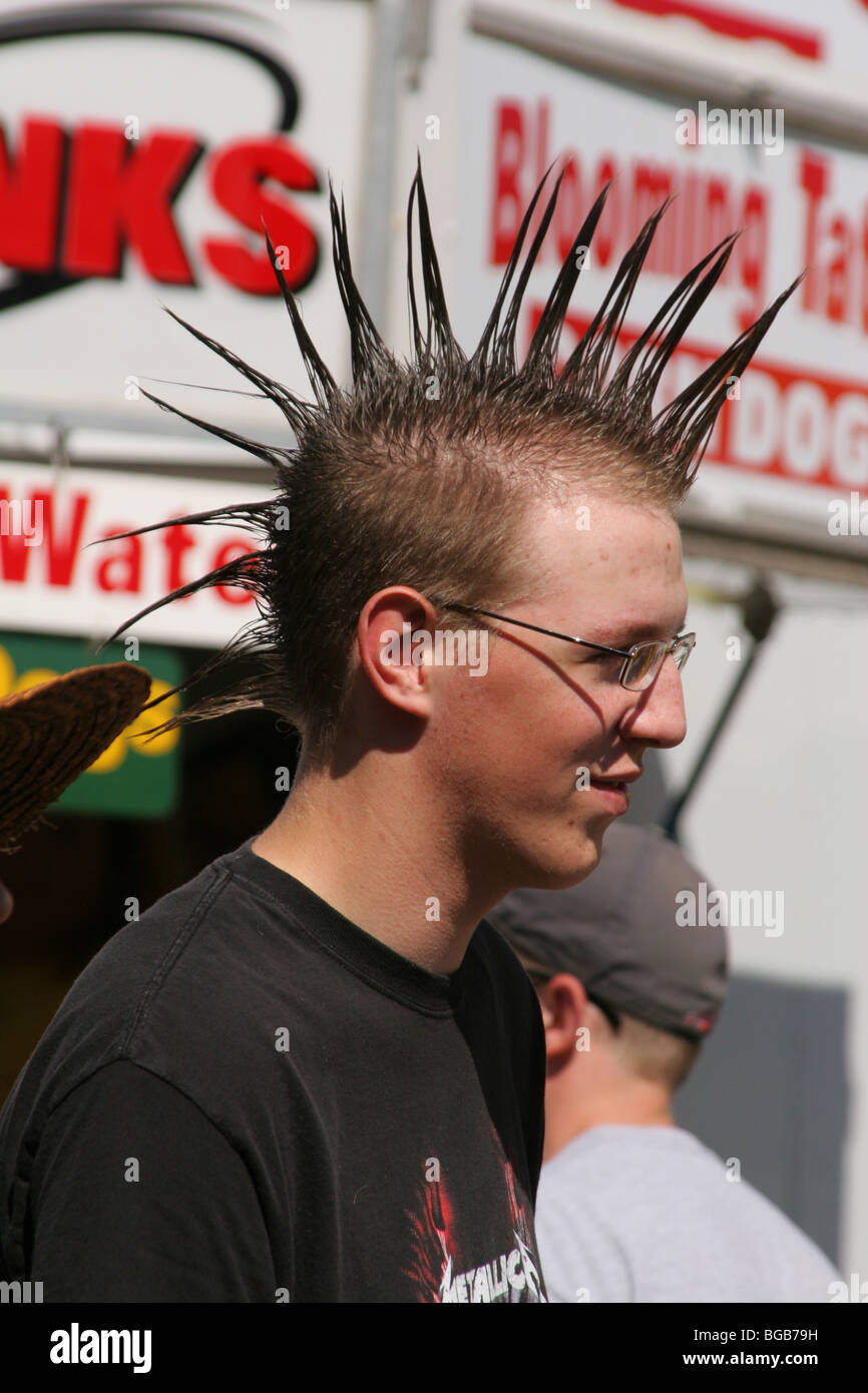 Teen Boy with Spiked Hair. Canfield Fair. Canfield, Ohio, USA. Tee shirt says Mettalica. Stock Photo