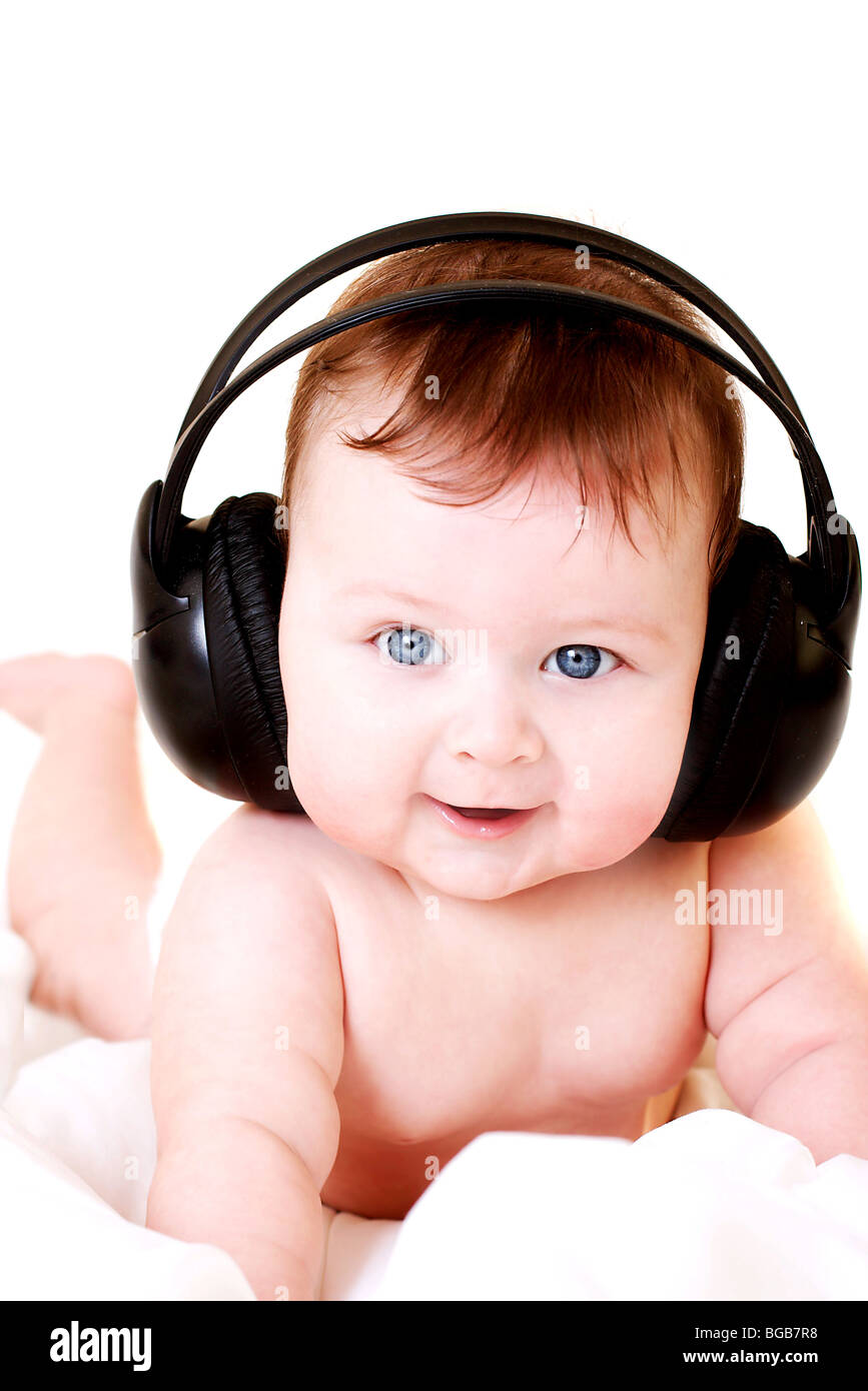 portrait of beautiful smiling baby with earphones Stock Photo Alamy