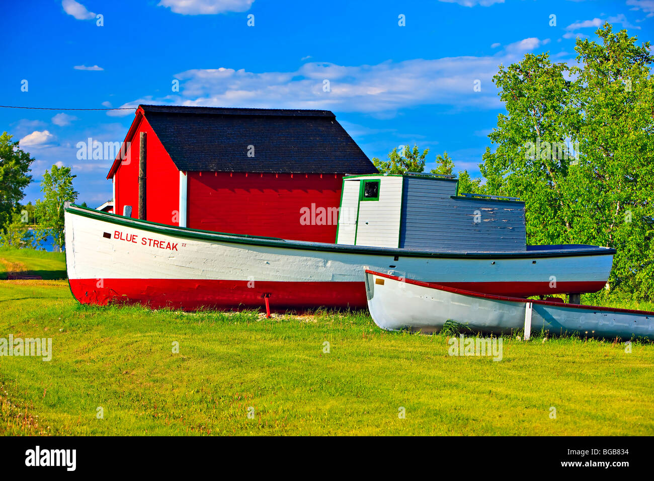 Old Boats and red shed in Hecla Village on the shores of Lake Winnipeg, Hecla Island, Manitoba, Canada. Stock Photo