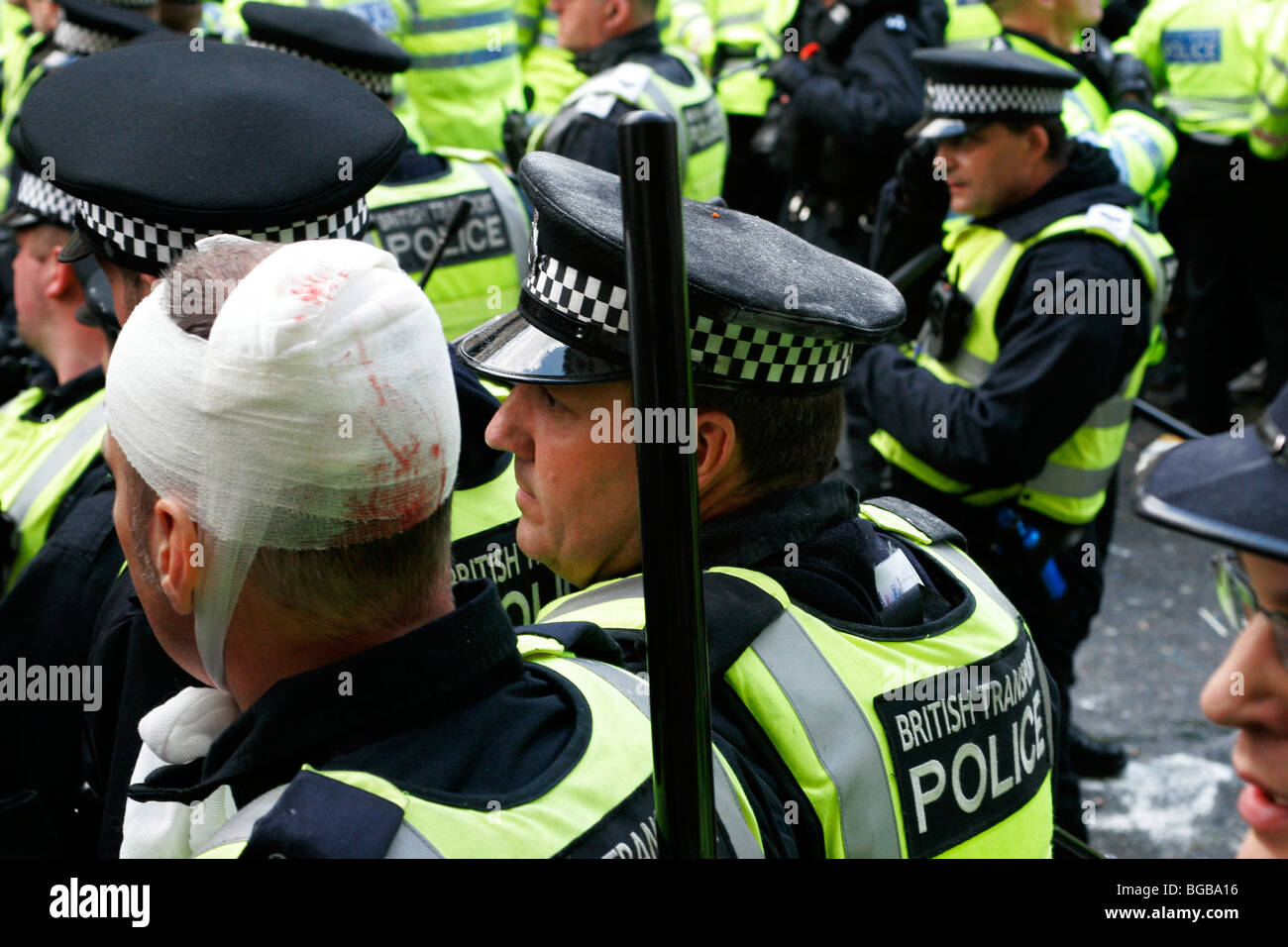 England, London, City, Threadneedle Street, Bank of England G20 Protests, April 2009 Police with one injured to head Stock Photo