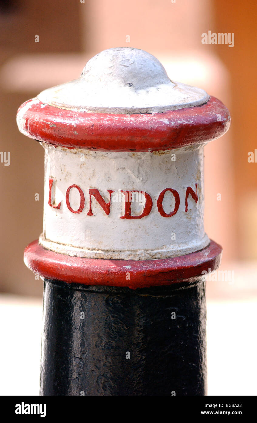 Photograph of bollard post iron cast London heritage lettering Stock Photo