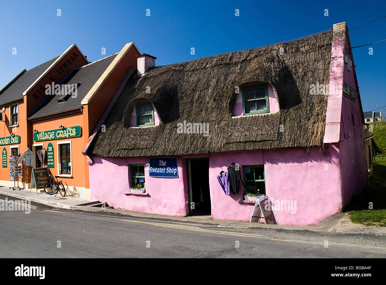 Ireland, County Clare, Doolin, colourful craft shops on village street