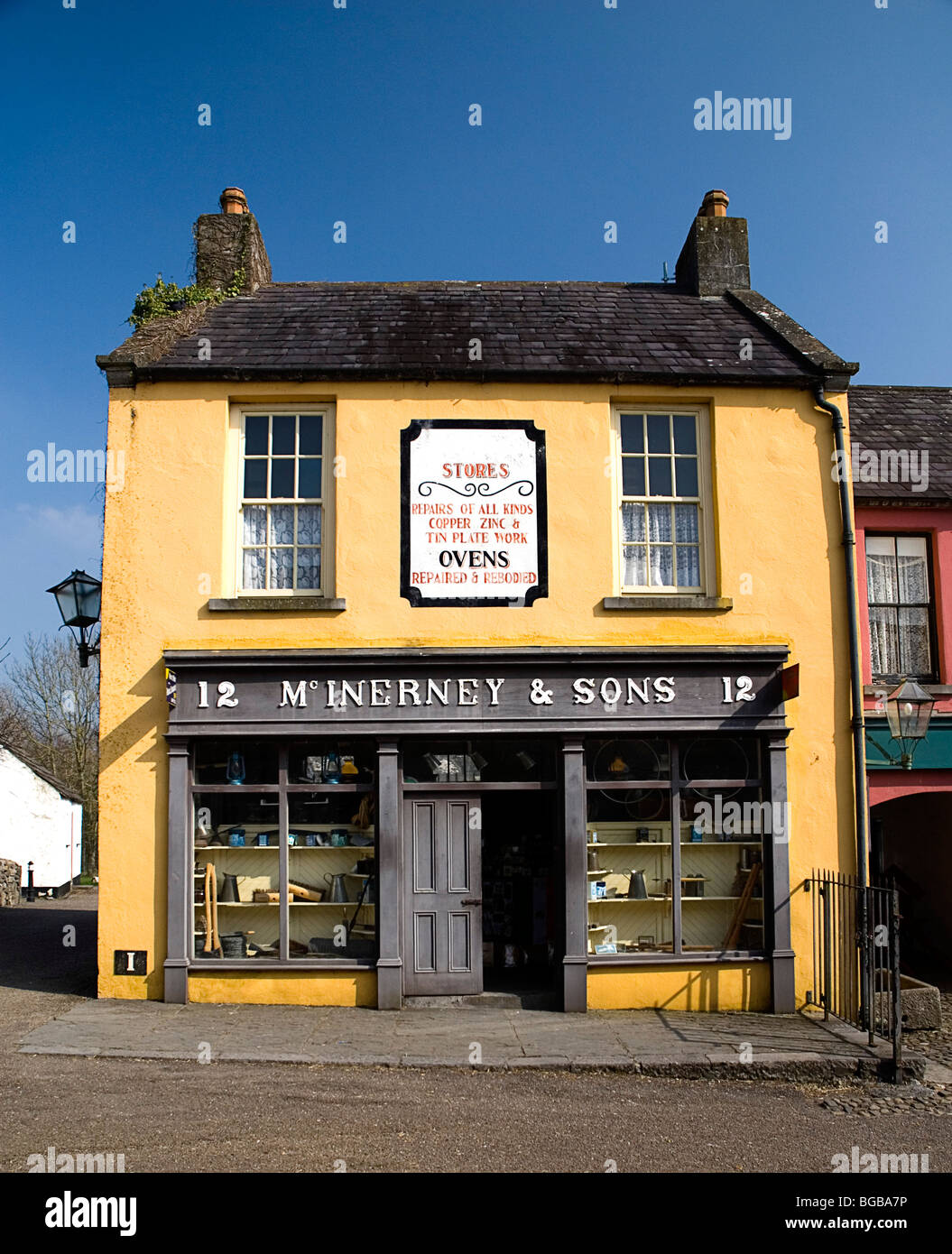 Ireland, County Clare, Bunratty Folk Park. The Village Street denotes life in 19th century Ireland, McInerney & Sons ironmongers Stock Photo