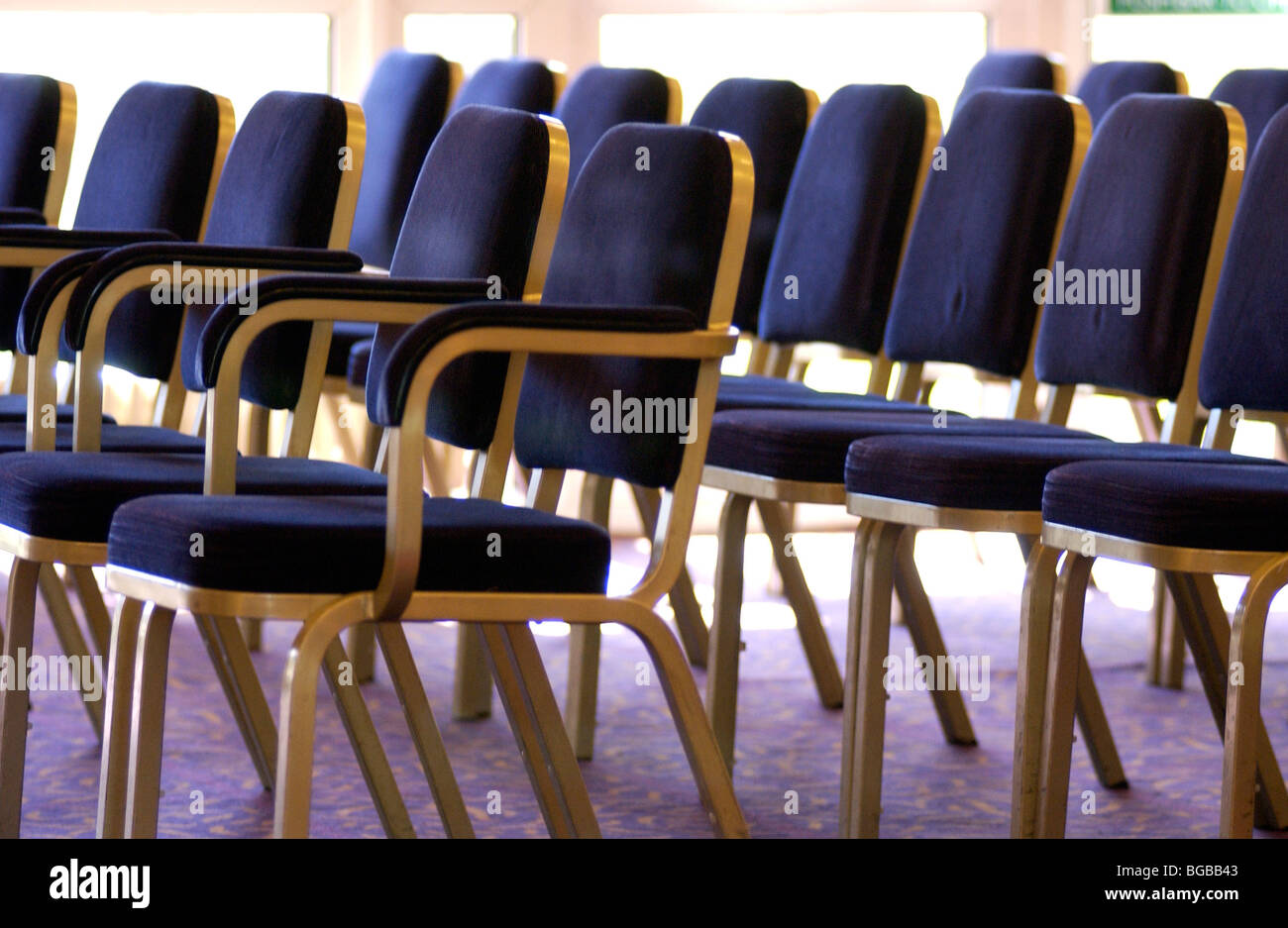 Photograph of rows seating wedding guests empty venue conference Stock Photo