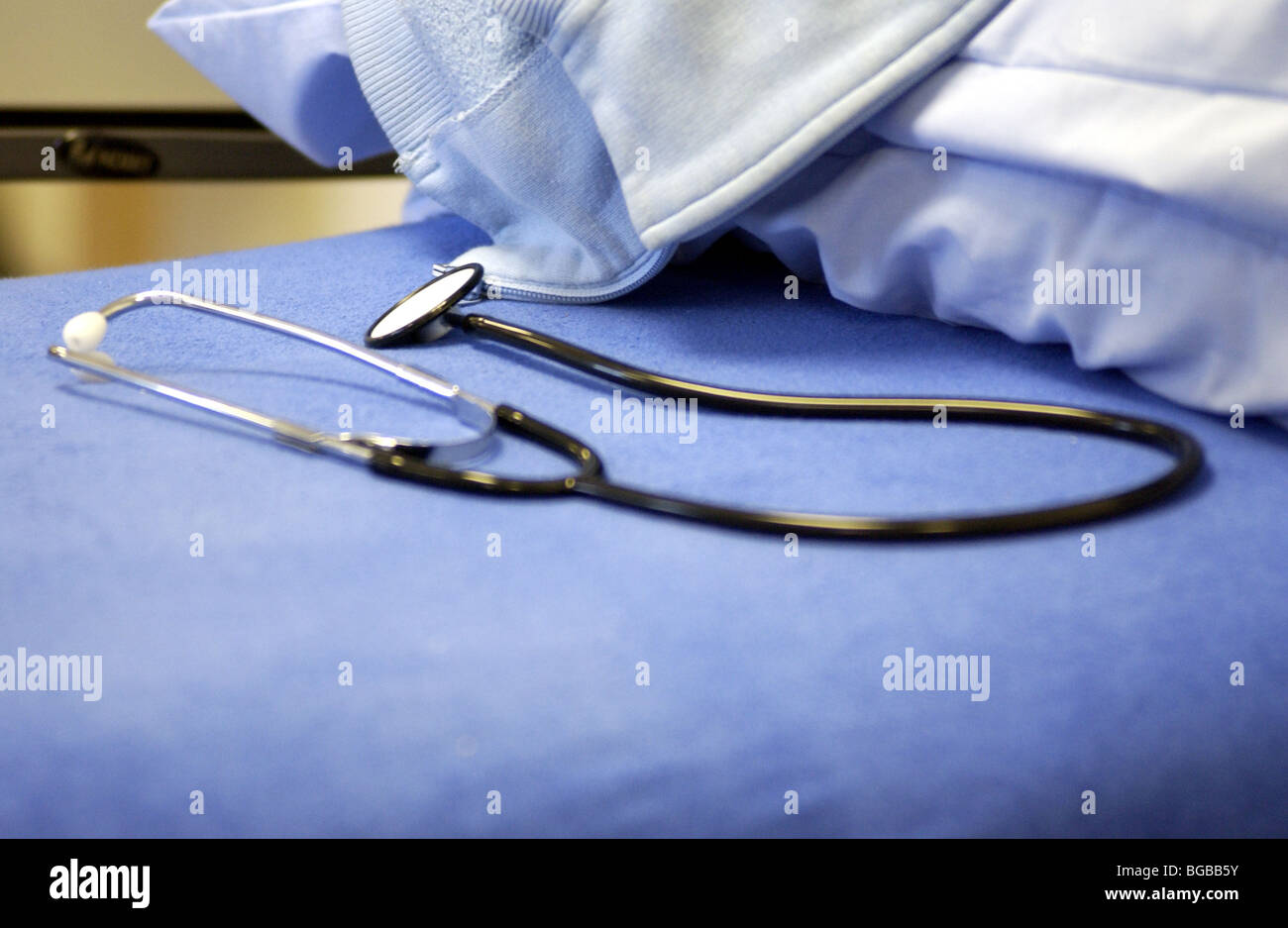 Royalty free photograph of stethoscope on NHS hospital bed Stock Photo