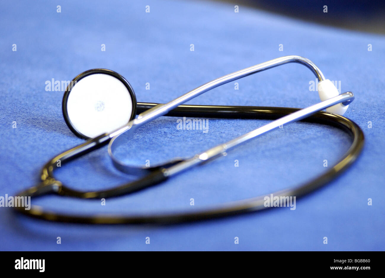 Royalty free photograph of stethoscope on NHS hospital bed Stock Photo