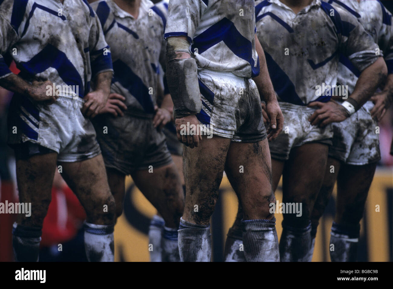 Mud covered rugby players Stock Photo