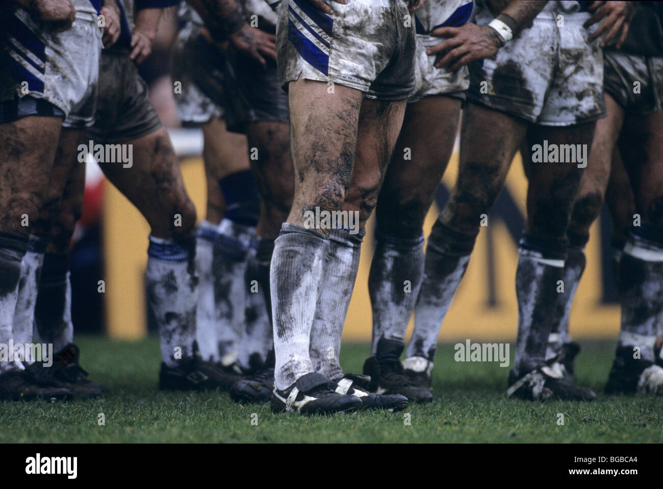 Mud covered rugby players Stock Photo