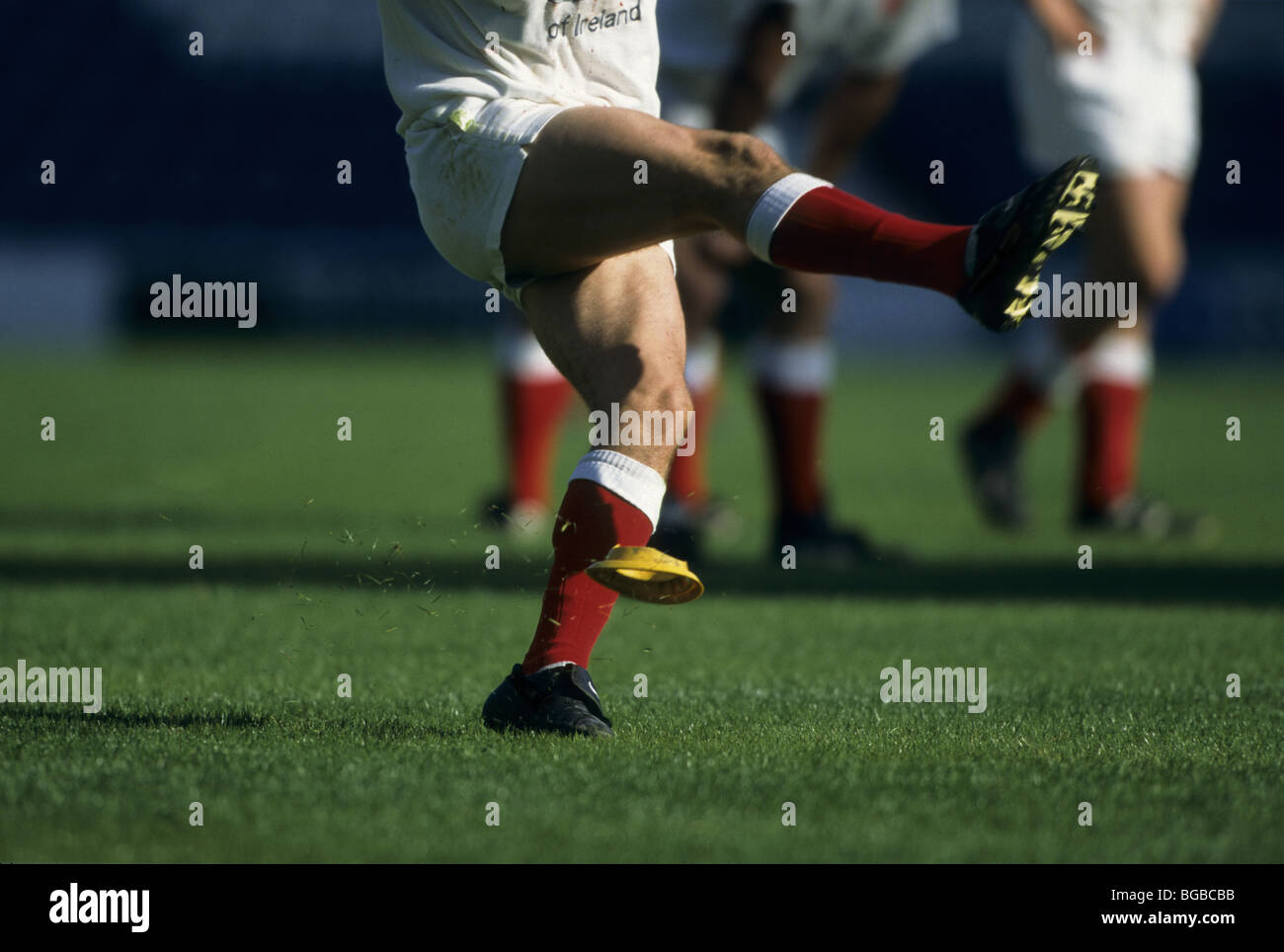 Rugby player kicks the ball off the tee Stock Photo Alamy