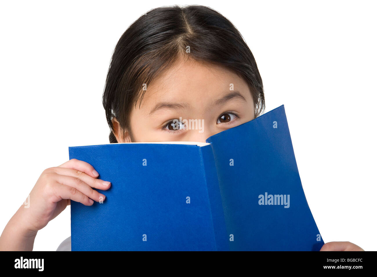 Little girl covers her face with a book Stock Photo Alamy