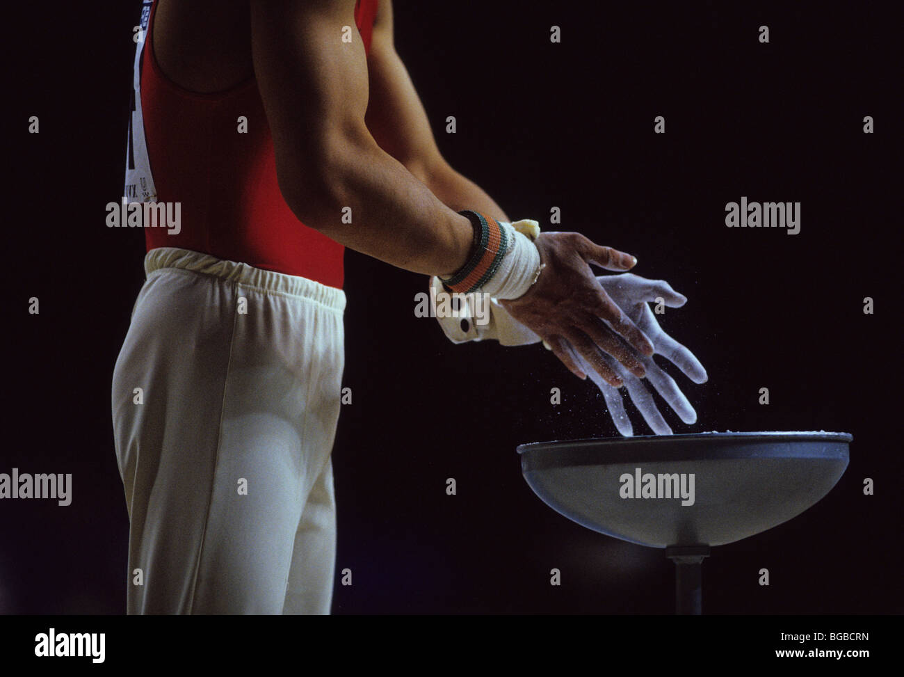 male gymnast chalking hands Stock Photo