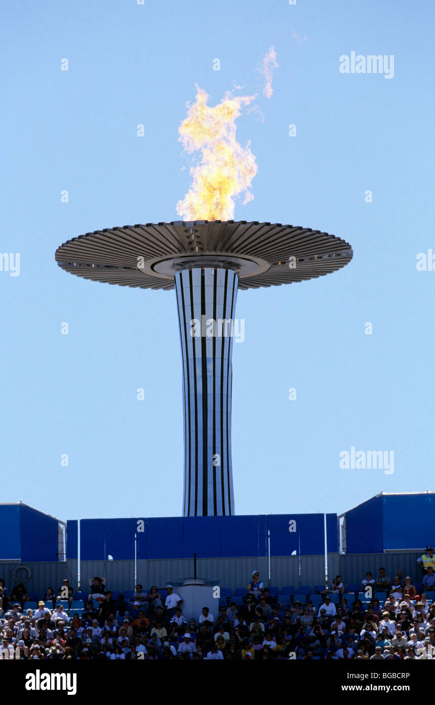Olympic torch above a stadium Stock Photo Alamy