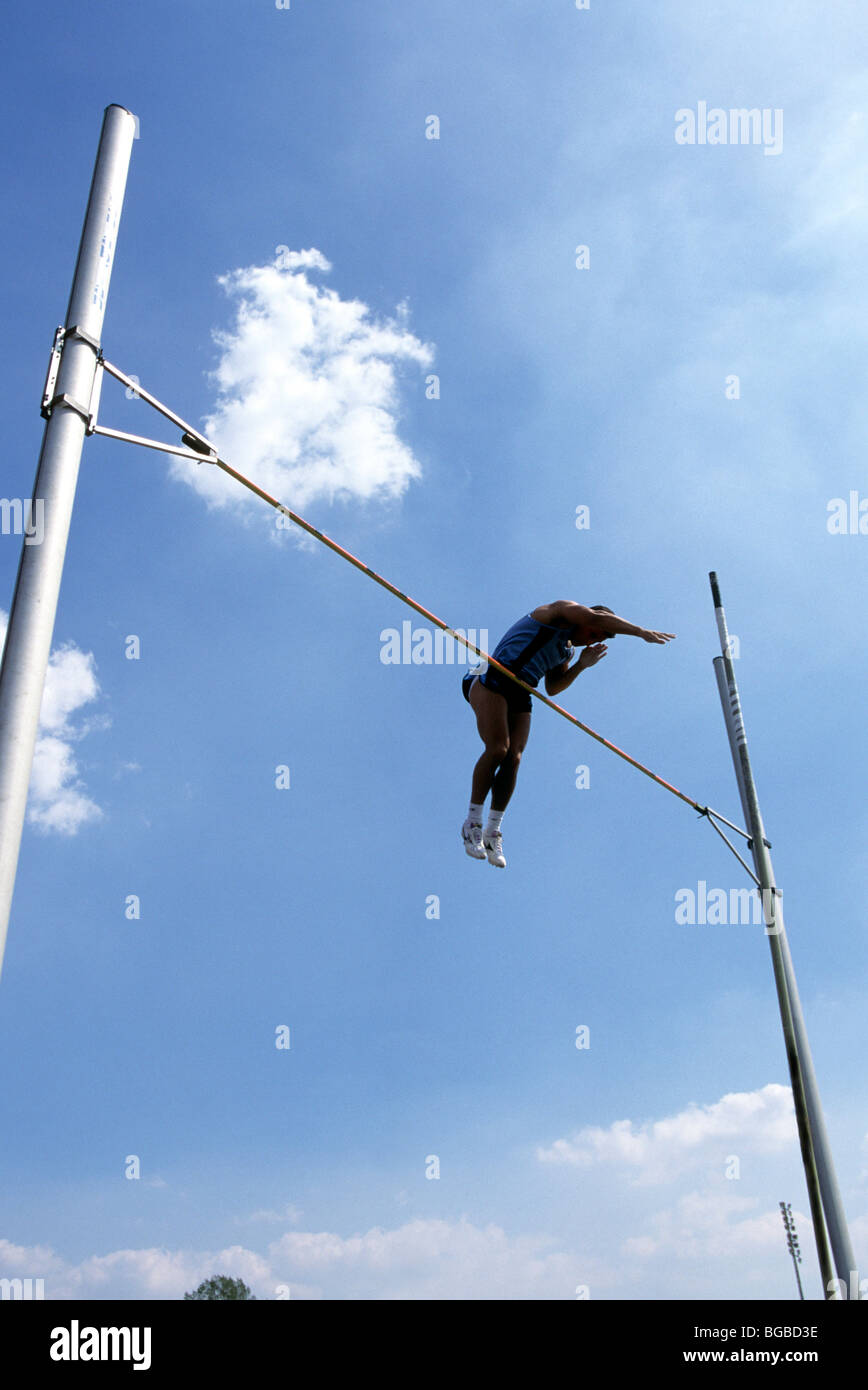 Male pole vaulter clearing the bar Stock Photo Alamy