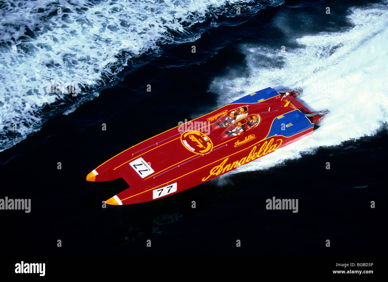 Red Powerboat Racing Red Multi Hull Powerboat drives through still water in race Stock Photo ...