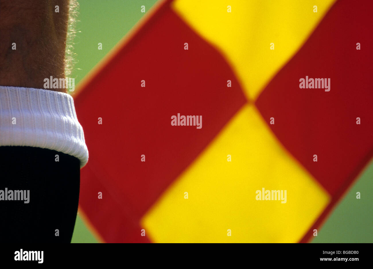 Football referee holding a flag Stock Photo Alamy