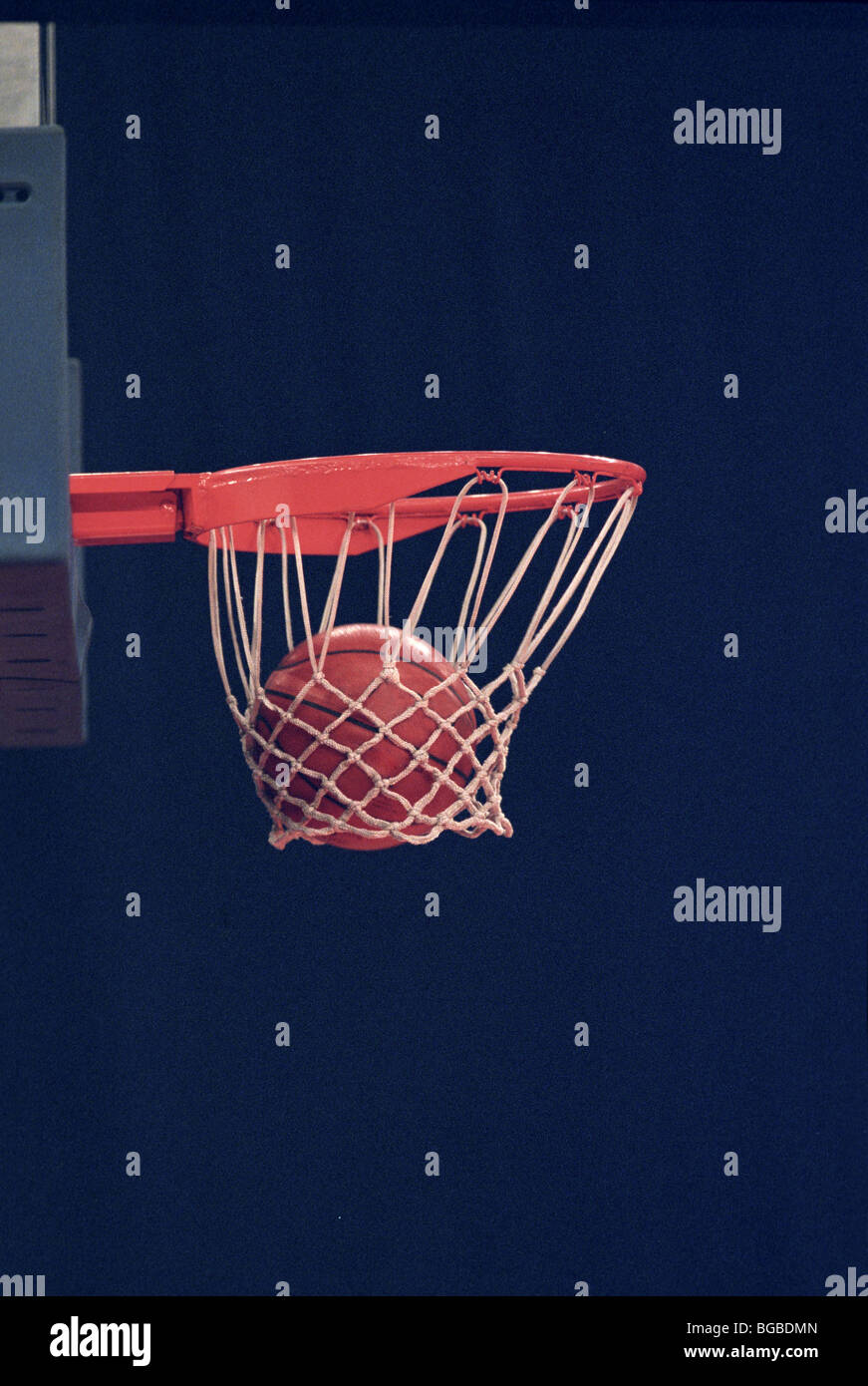 Basketball going through a hoop Stock Photo Alamy