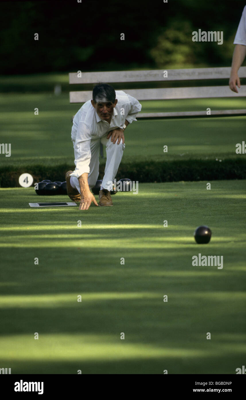 Man playing lawn bowls Stock Photo