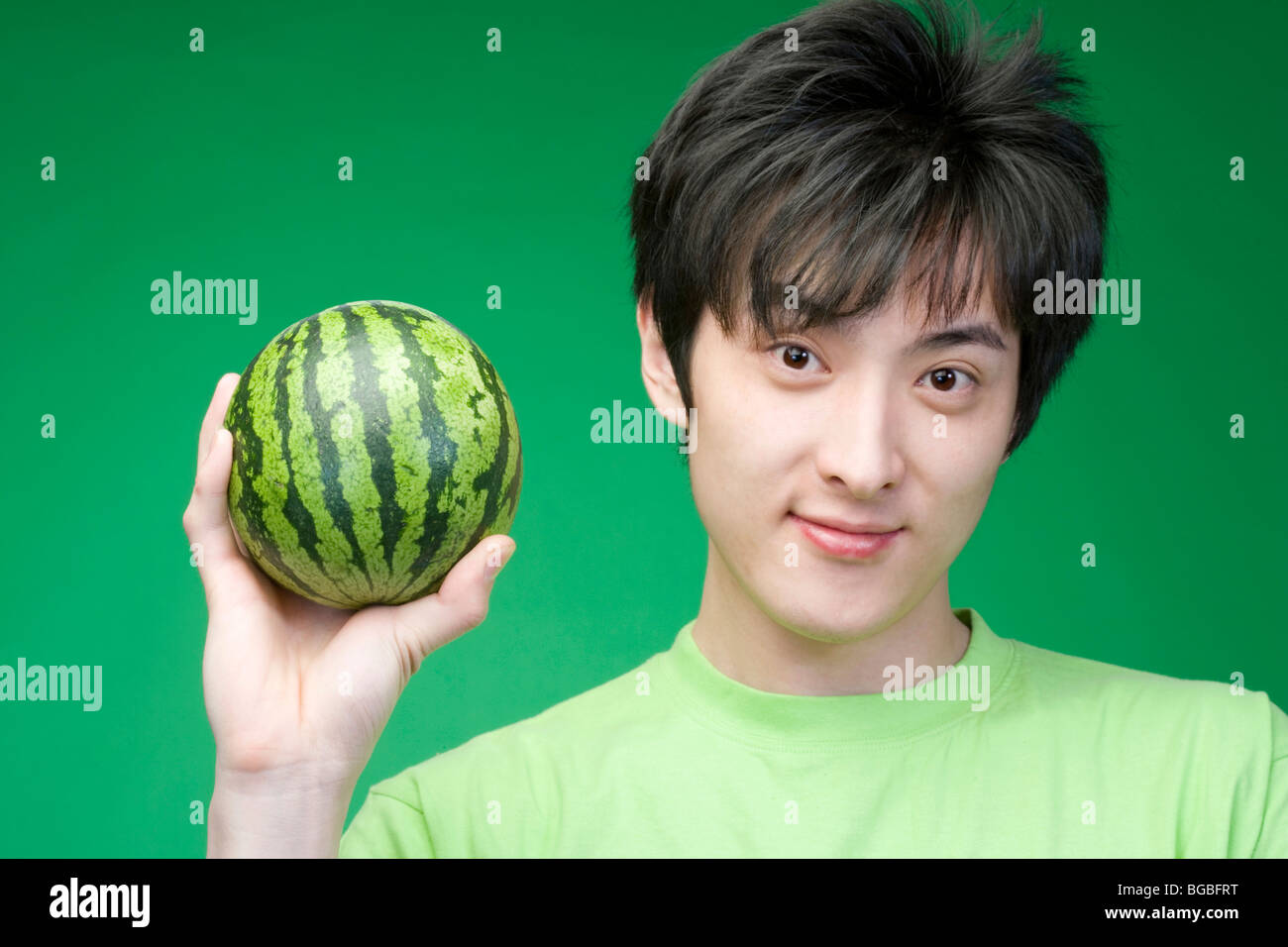 Melon head man holding melon hires stock photography and images Alamy