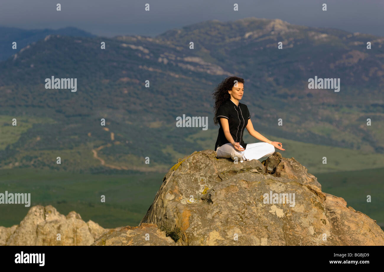 Woman posing on rocks mountain hi-res stock photography and images - Alamy