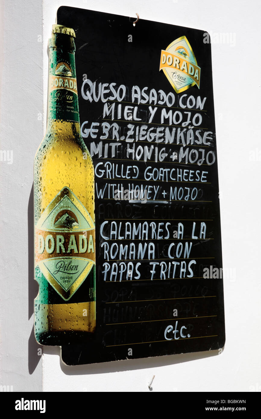Menu blackboard in Spanish German and English outside a bar in Masca on  Tenerife Canary Islands Spain Stock Photo - Alamy